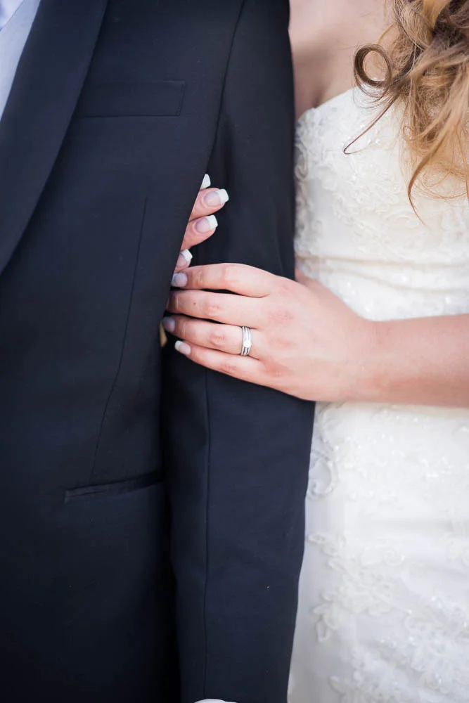 A portrait of a bride holding her groom moments after their wedding at Windows on Washington.