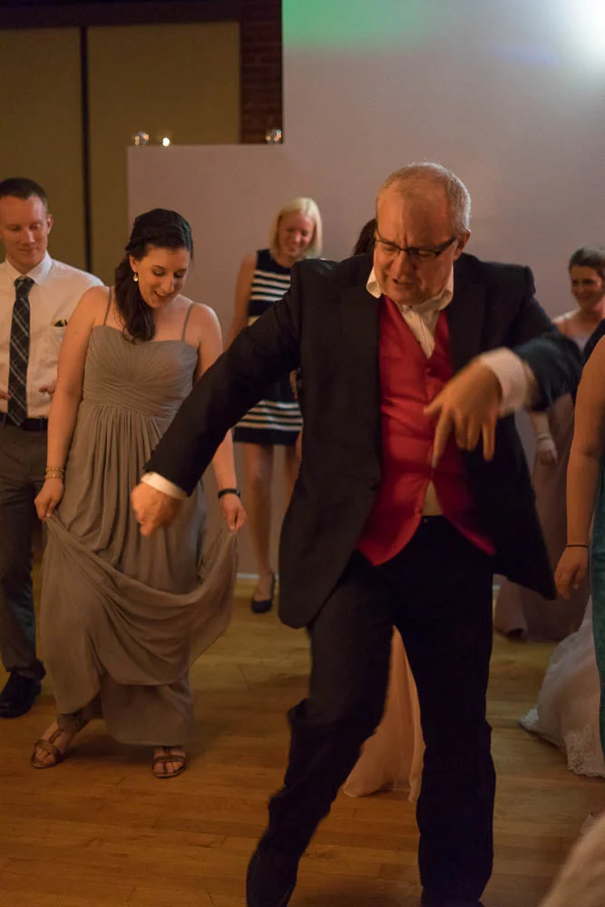 A wedding guest busts a move while dancing at a wedding reception at Jim Edmonds Space 15. 