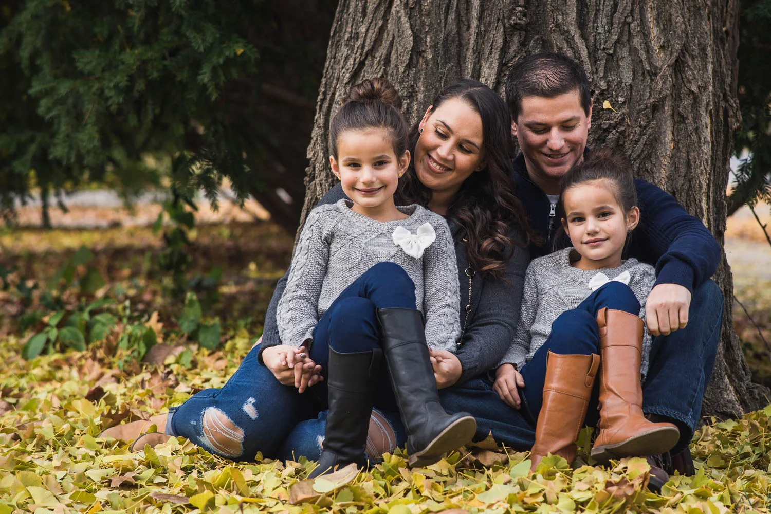 A family poses during their family photoshoot in Tower Grove Park. 