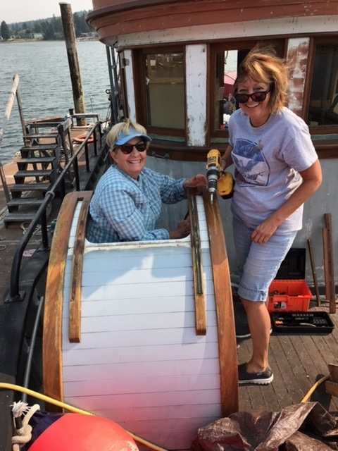 Patt Lapp and Dawn Ellis at work on the scuttle. 