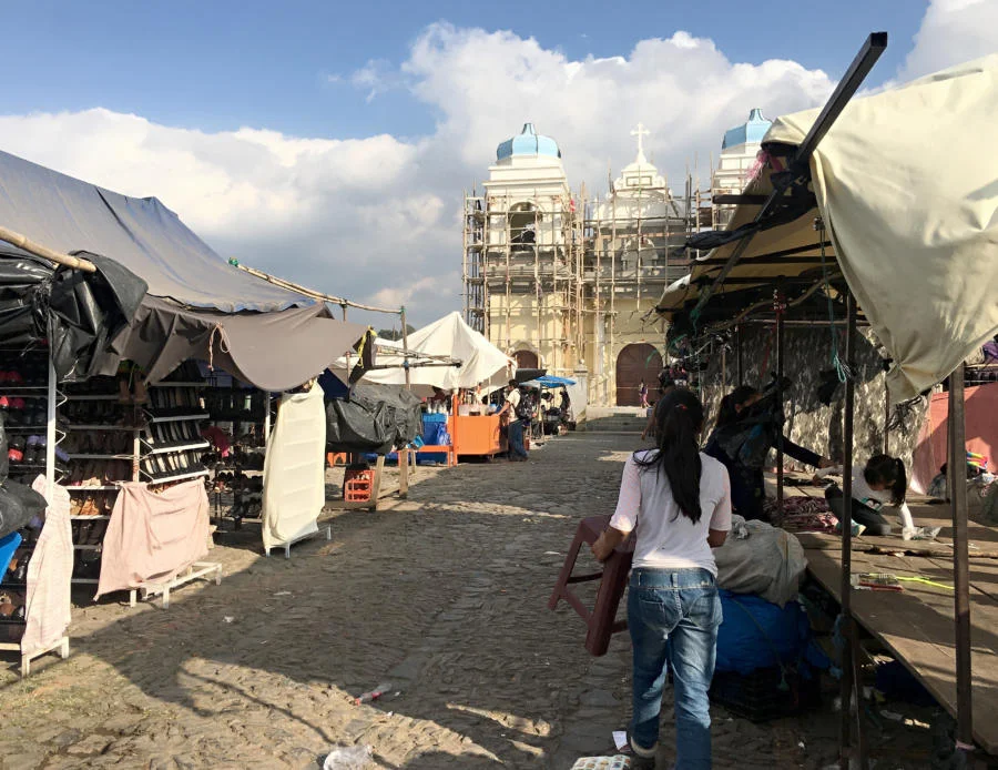 Vendors at an open-air market in San Martin Jilotepeque, Guatemala, prepare to close their stands after a busy day. From the Albuquerque Journal