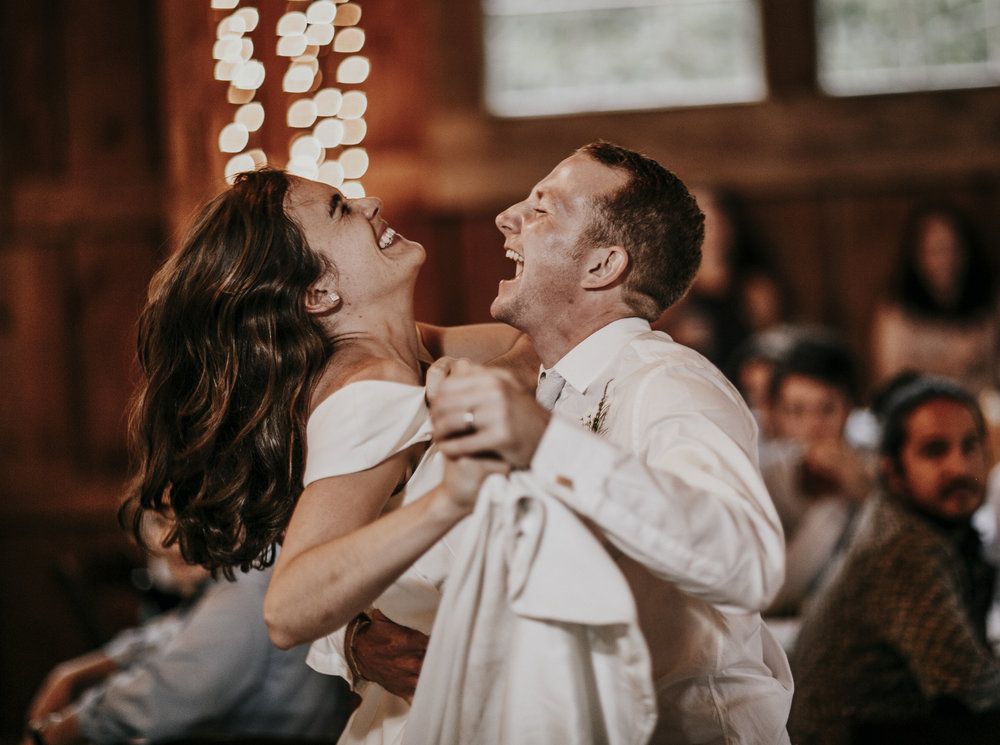 a couples first dance in the barn at Josias River Farm