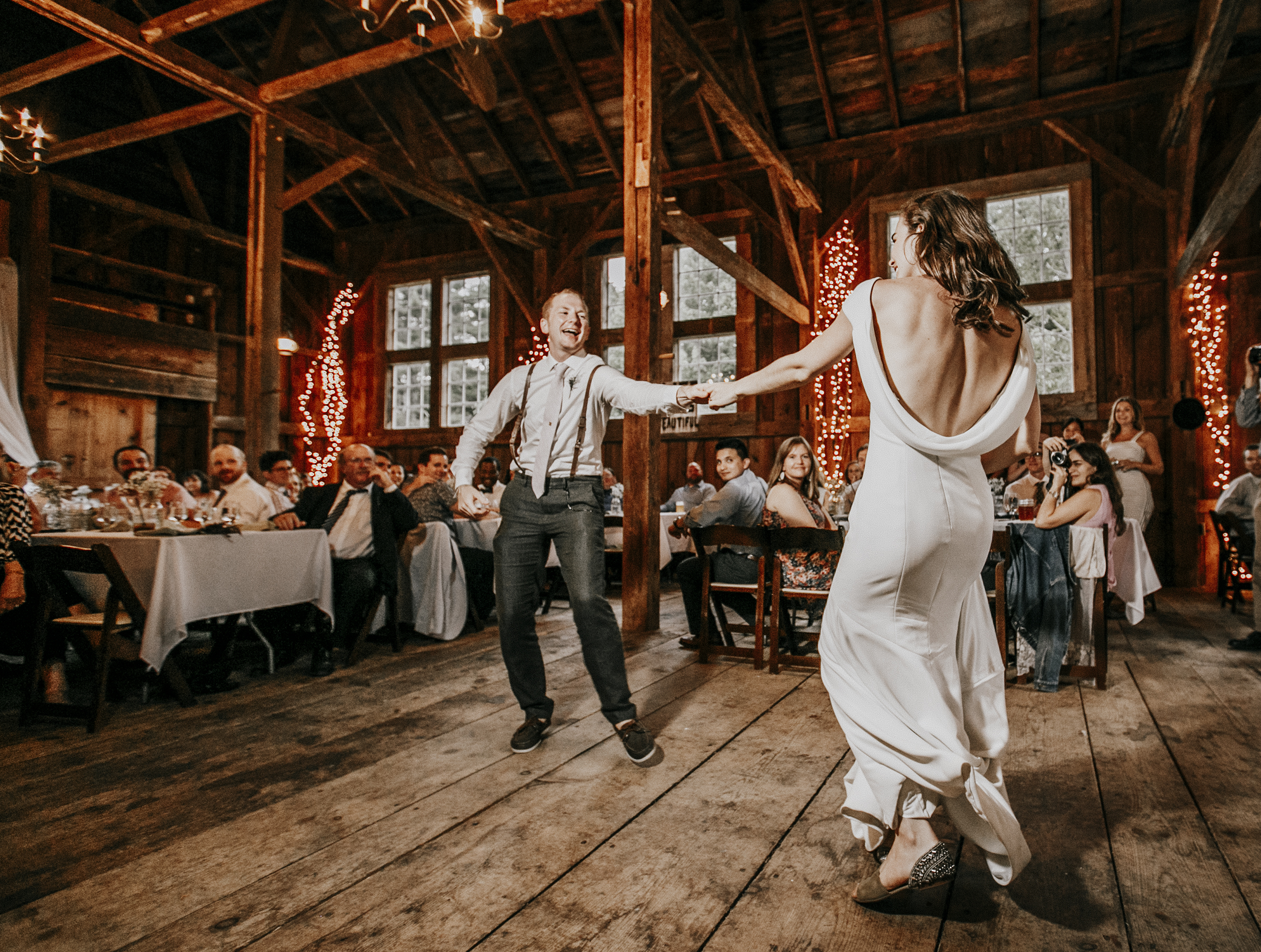 A couple's first dance in the barn at Josias River Farm