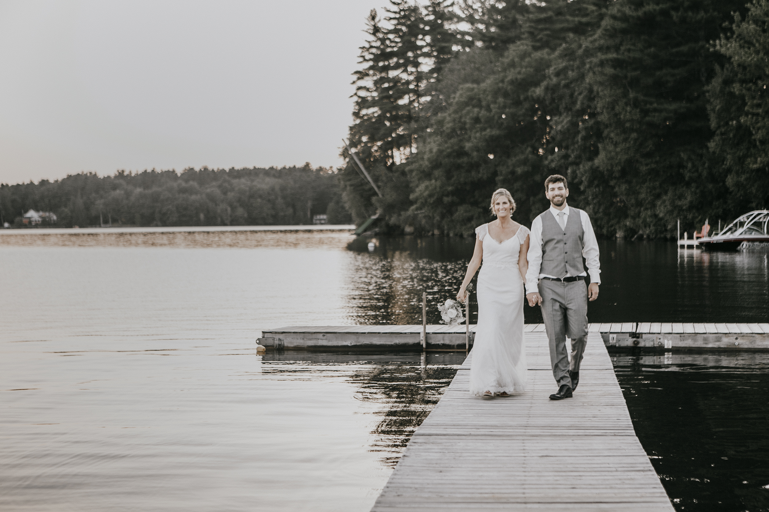 bride and groom walk the dock, kingsley pines