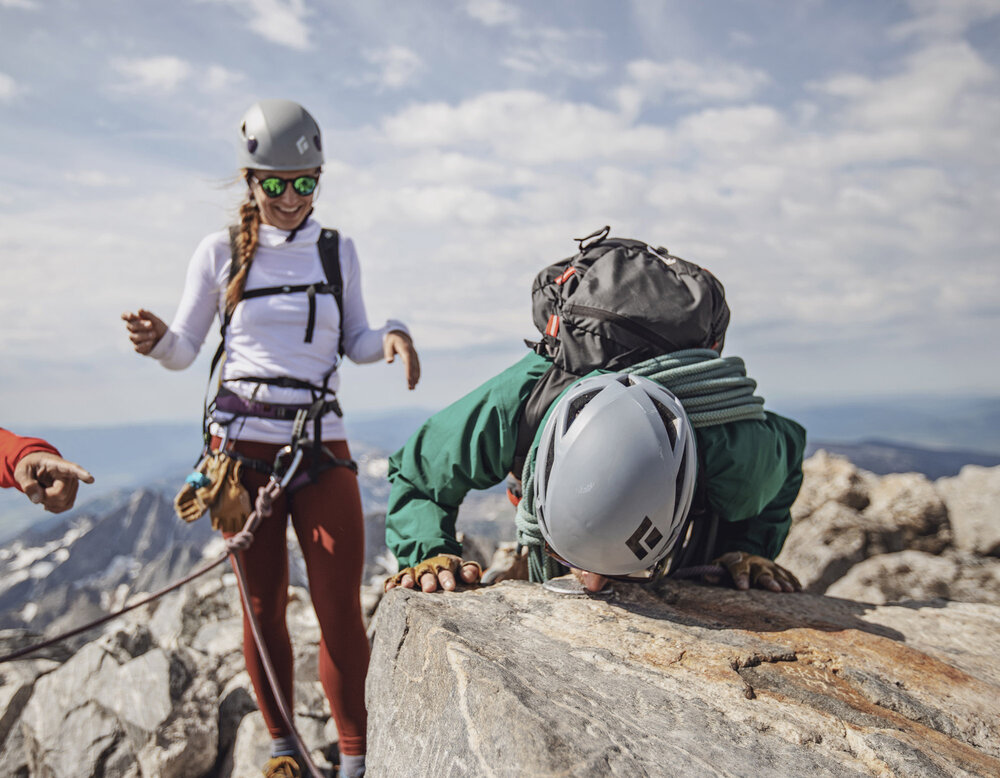  Collin kisses the metal disk marking the summit of the Grand Teton, 13,770ft. 