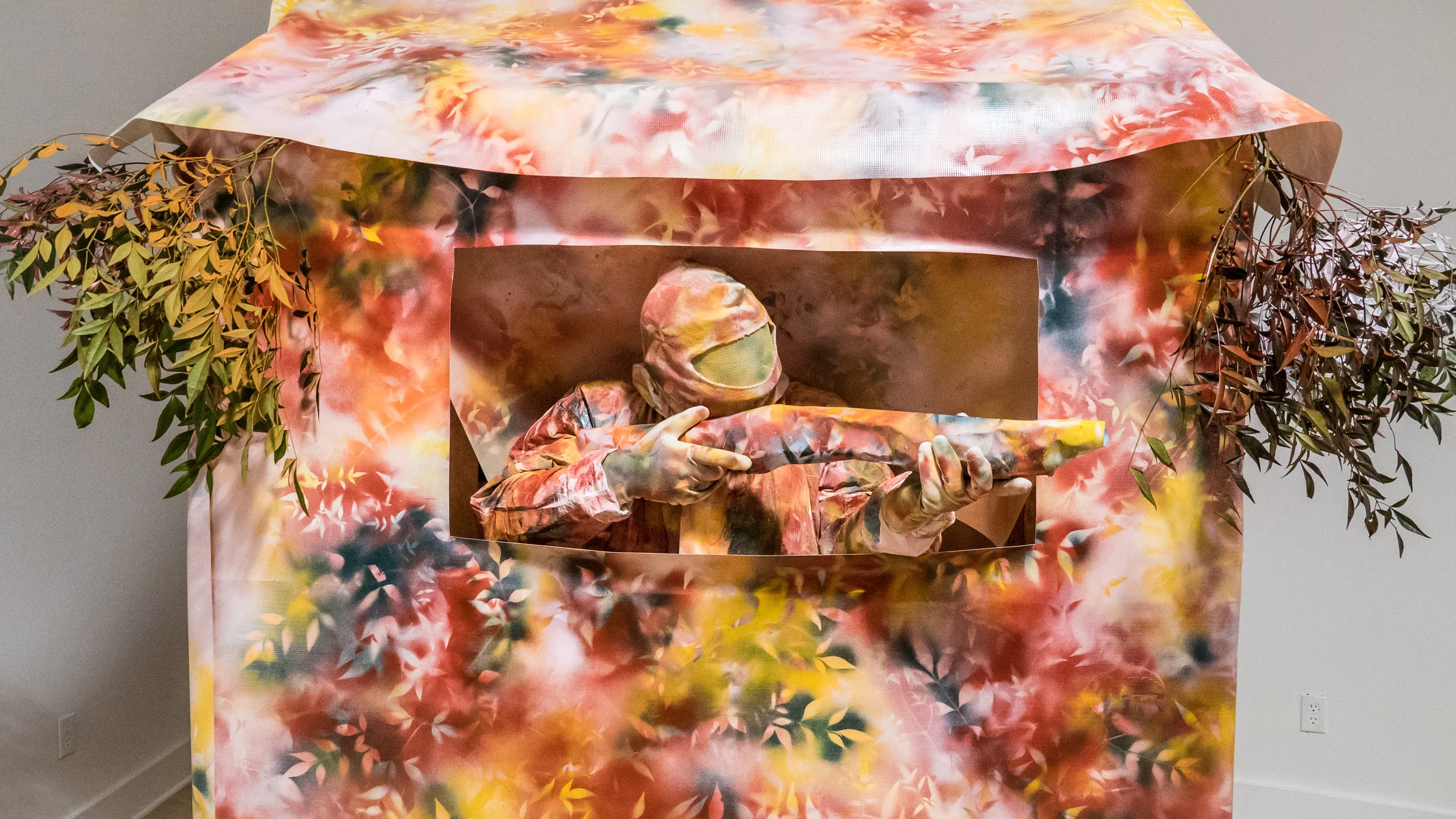 Blind Love vinyl, spray paint, foliage, painter's suit with gloves & head sock, paper, tape