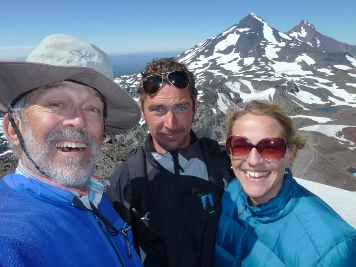 ian dad and clara on a walk in the woods