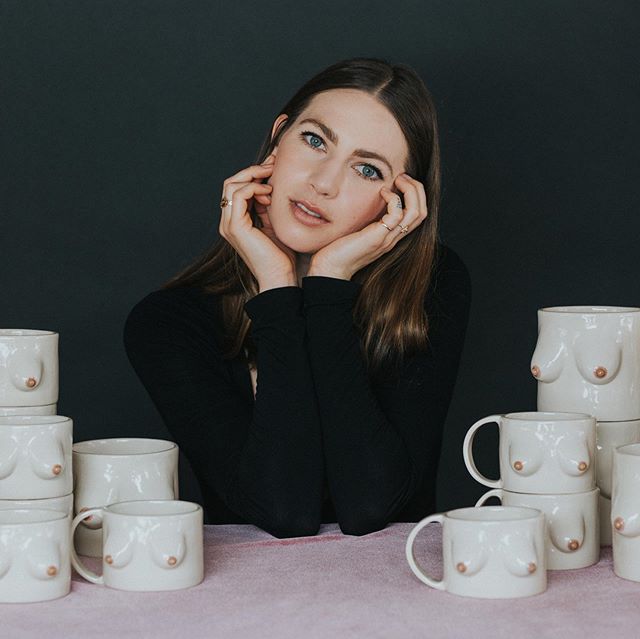 This is a portrait of @tankturner surrounded by her handmade mugs. Alicia does not use a mold to make these mugs, but hand carves each piece so that no two are alike. Some of her pottery tends toward what I affectionately describe as &ldquo;charmingl