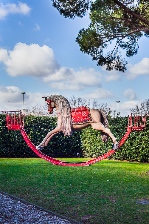 Random items like this rocking horse seesaw dot the grounds of Cinecittà.