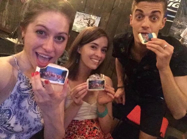 Dancers Madeline Charles, Katie Wilson, and Jake Elvig showing off their special cookies with Born Dancing pictures on them.