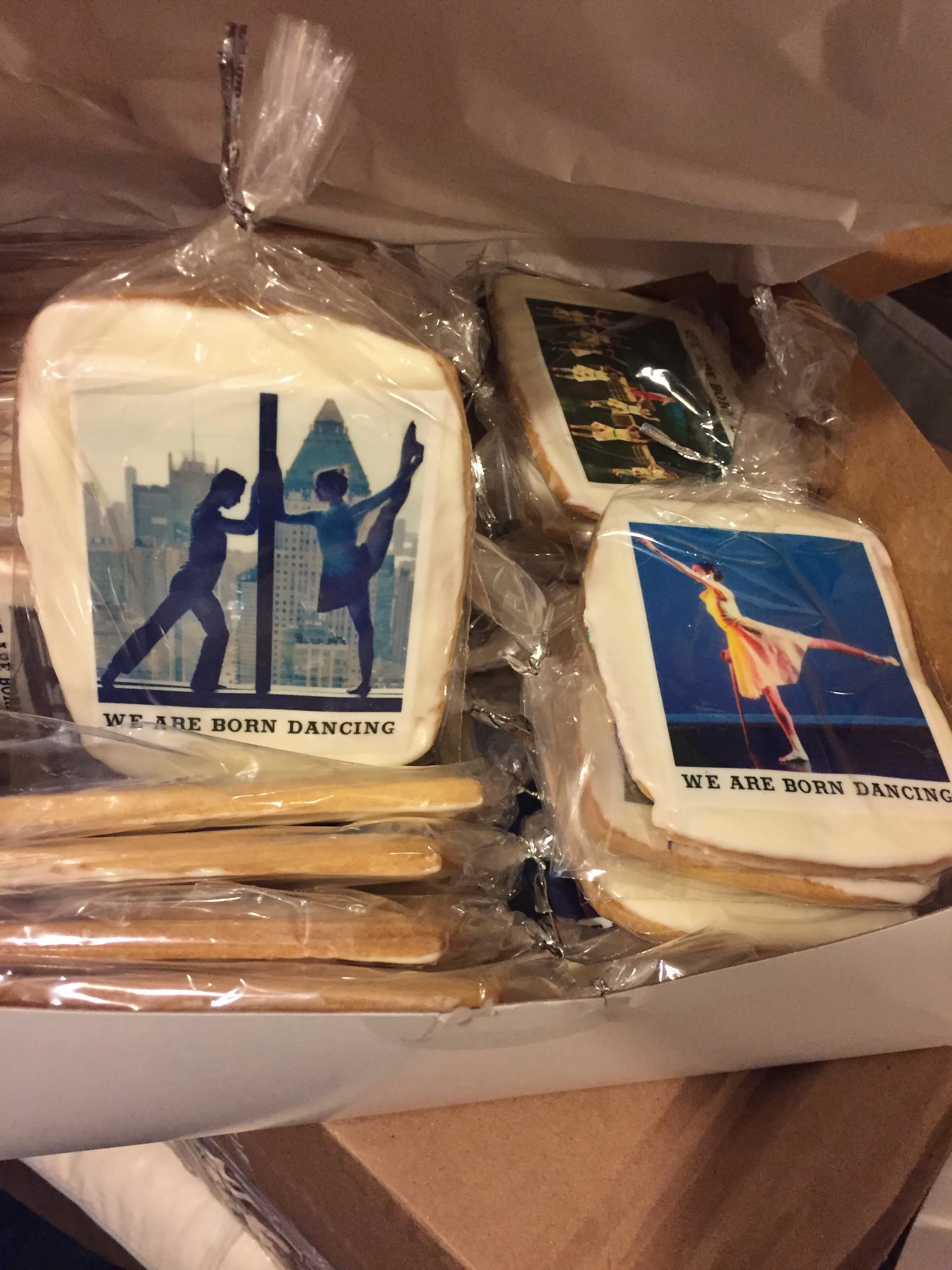 Individually wrapped cookies with photos of Born Dancing dancers printed on them.