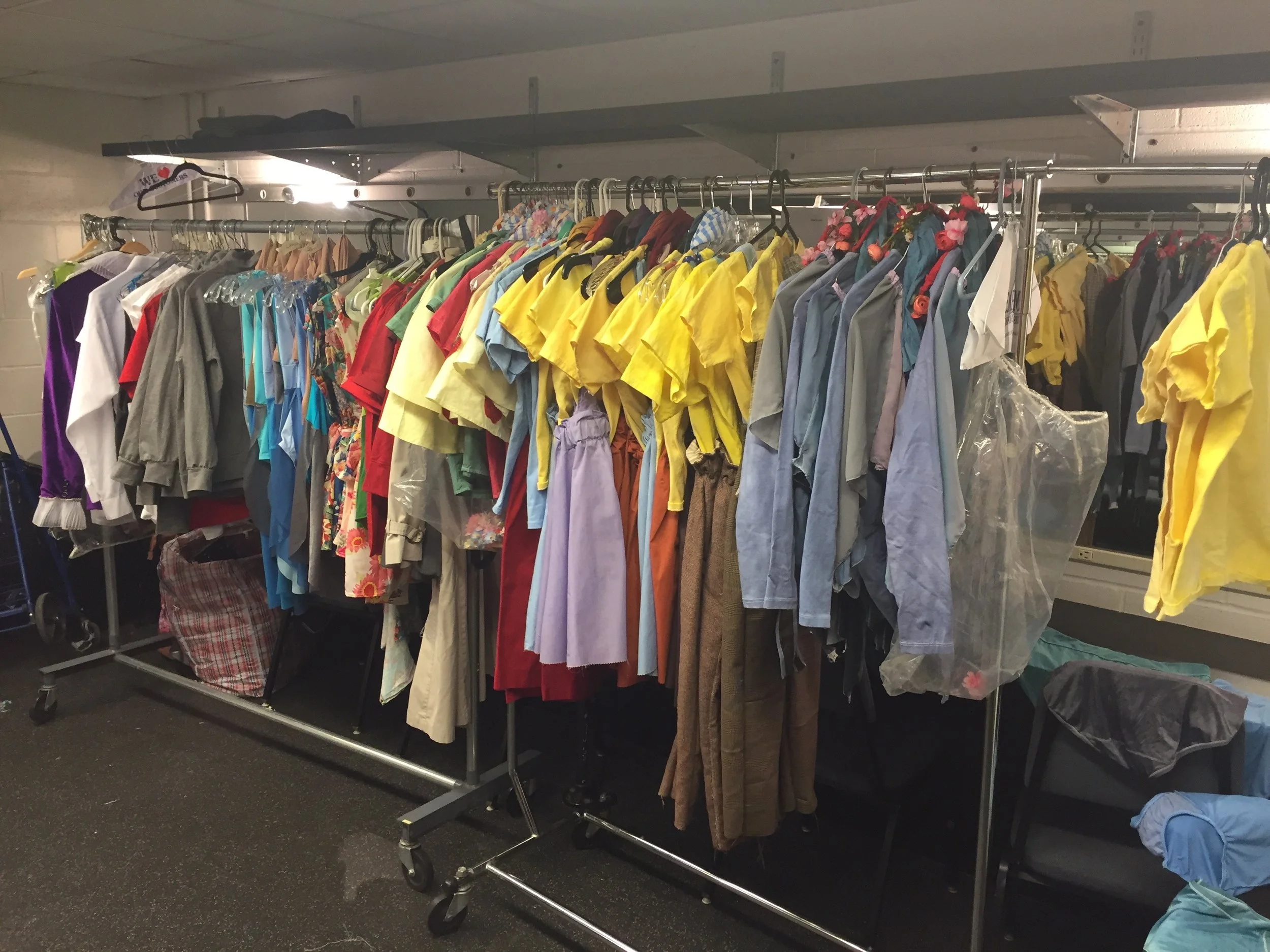 70 different costumes on two costume racks in the dressing room.