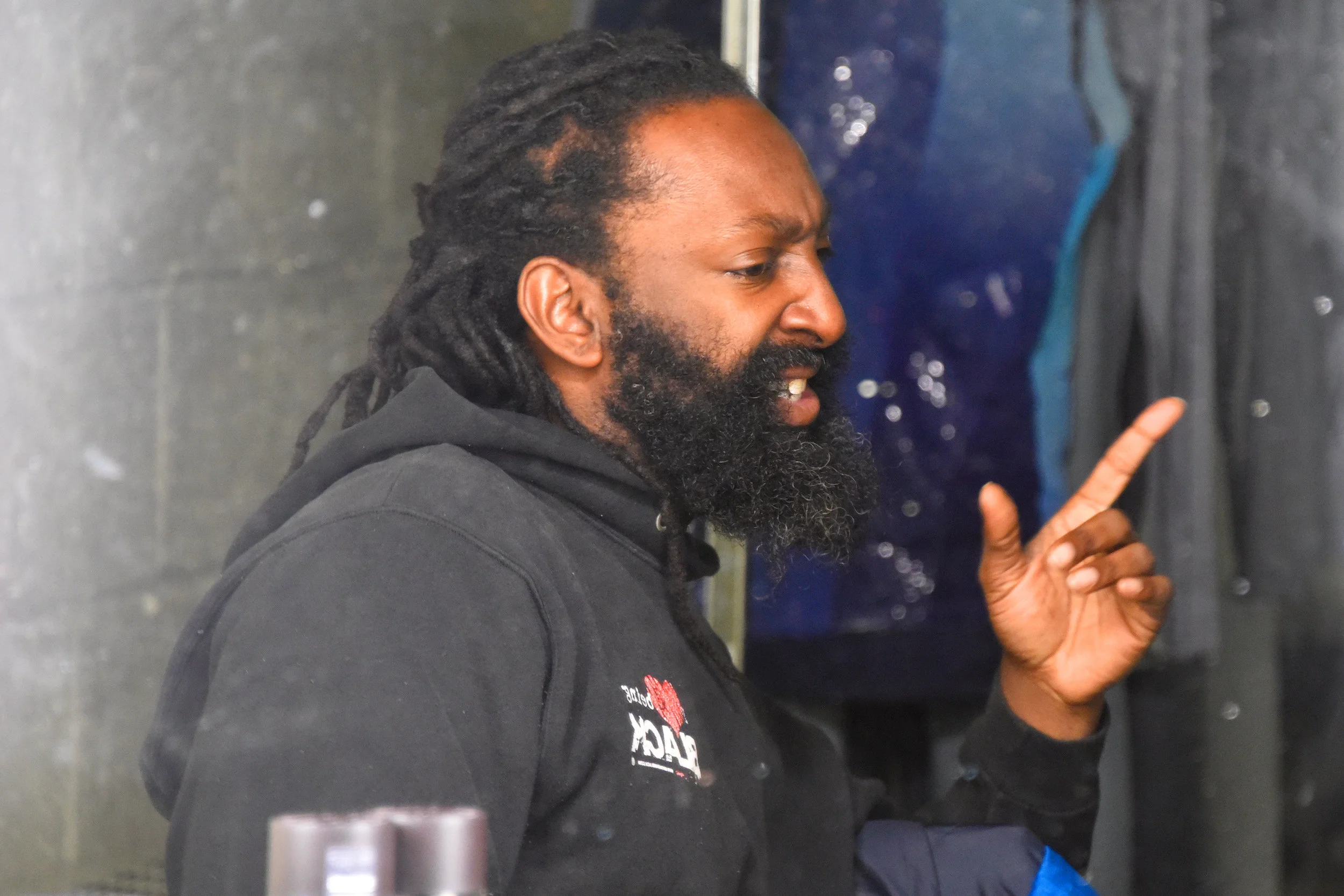 Dancer Antoine Hunter in the dressing room having a conversation in American Sign Language.
