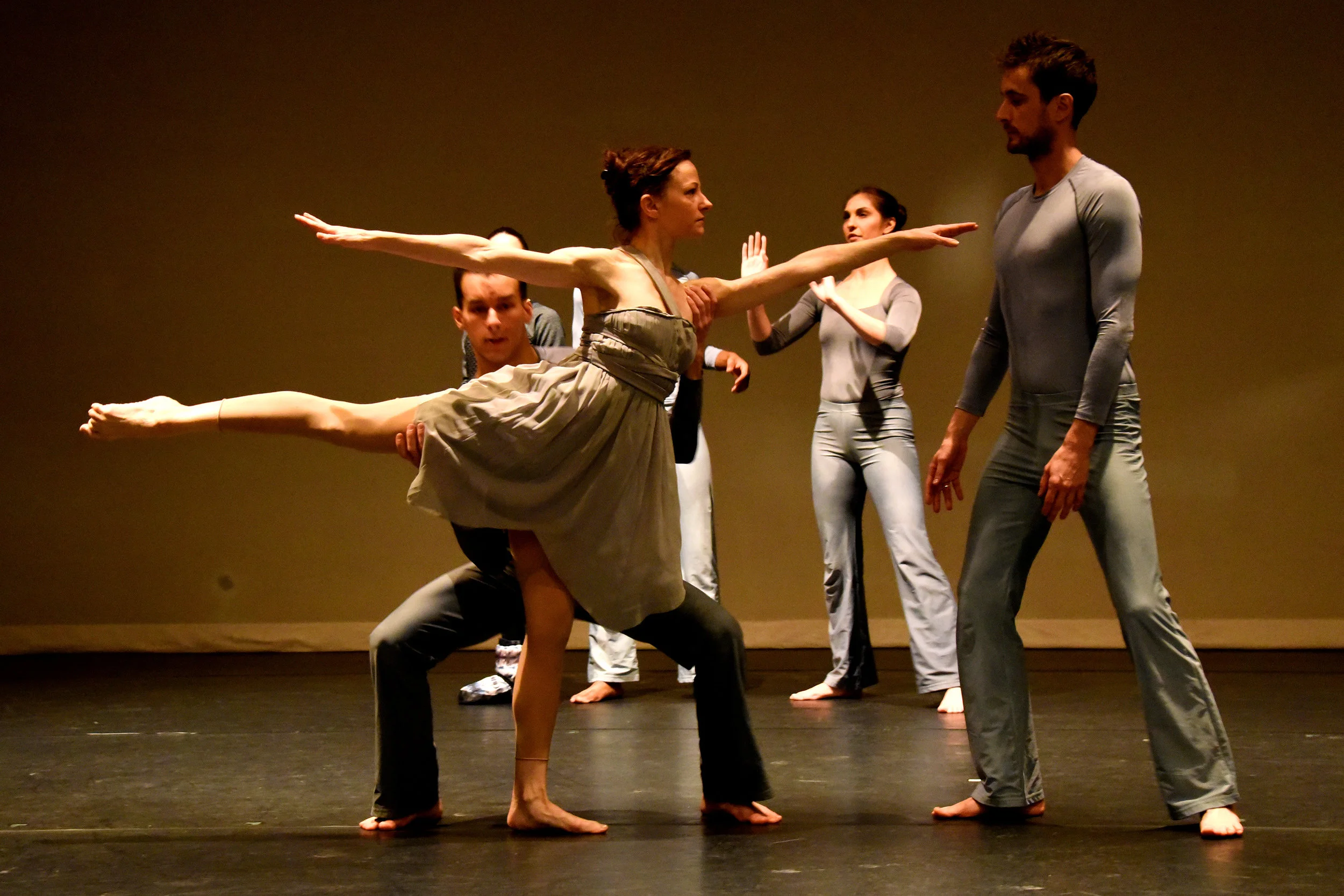 Dancer Nicole Speletic and her male dance partners get ready to practice a lift during Lift Call on stage.