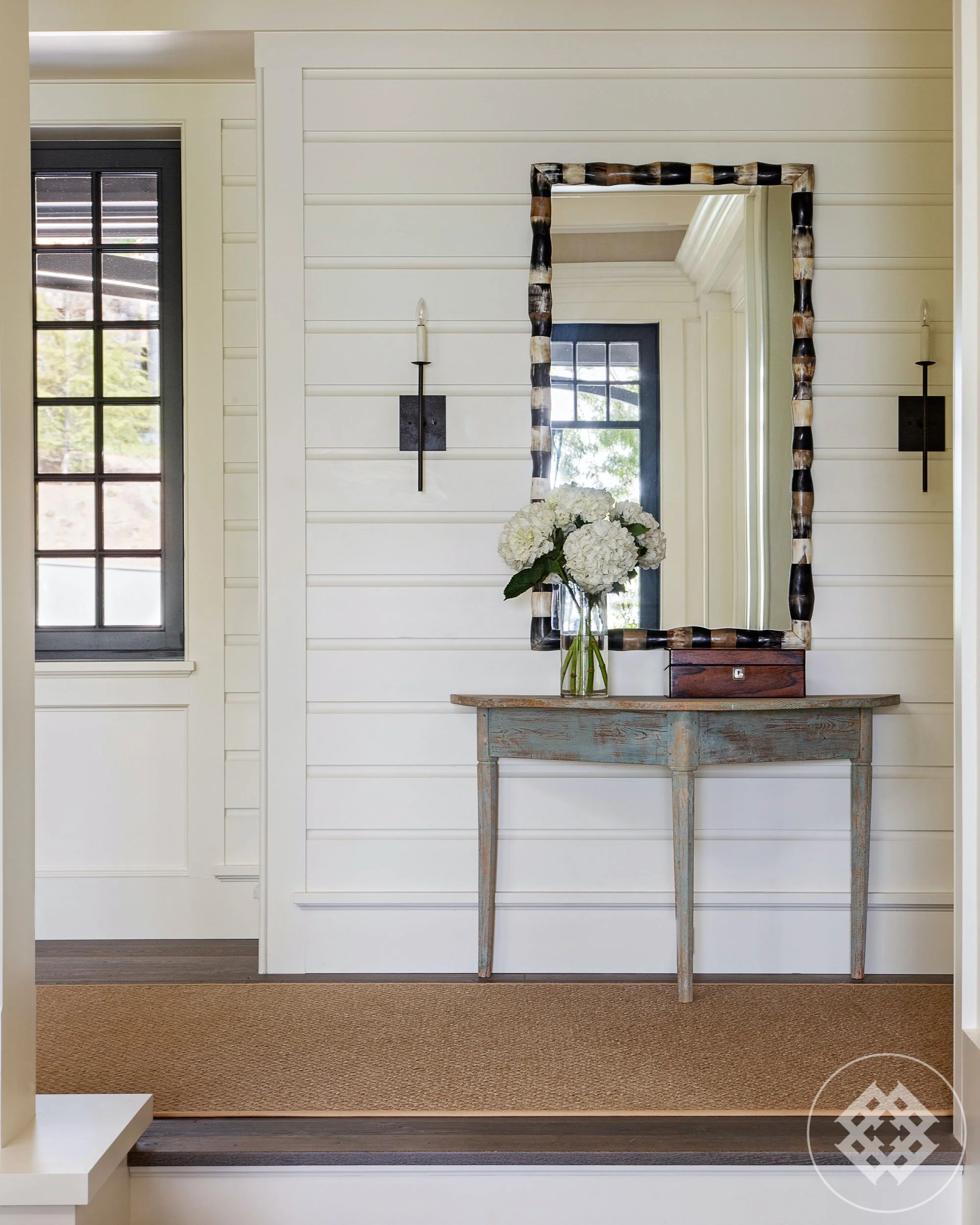 kkl-entryway-with-antique-demi-lune-table-against-painted-butted-board-wall.jpg
