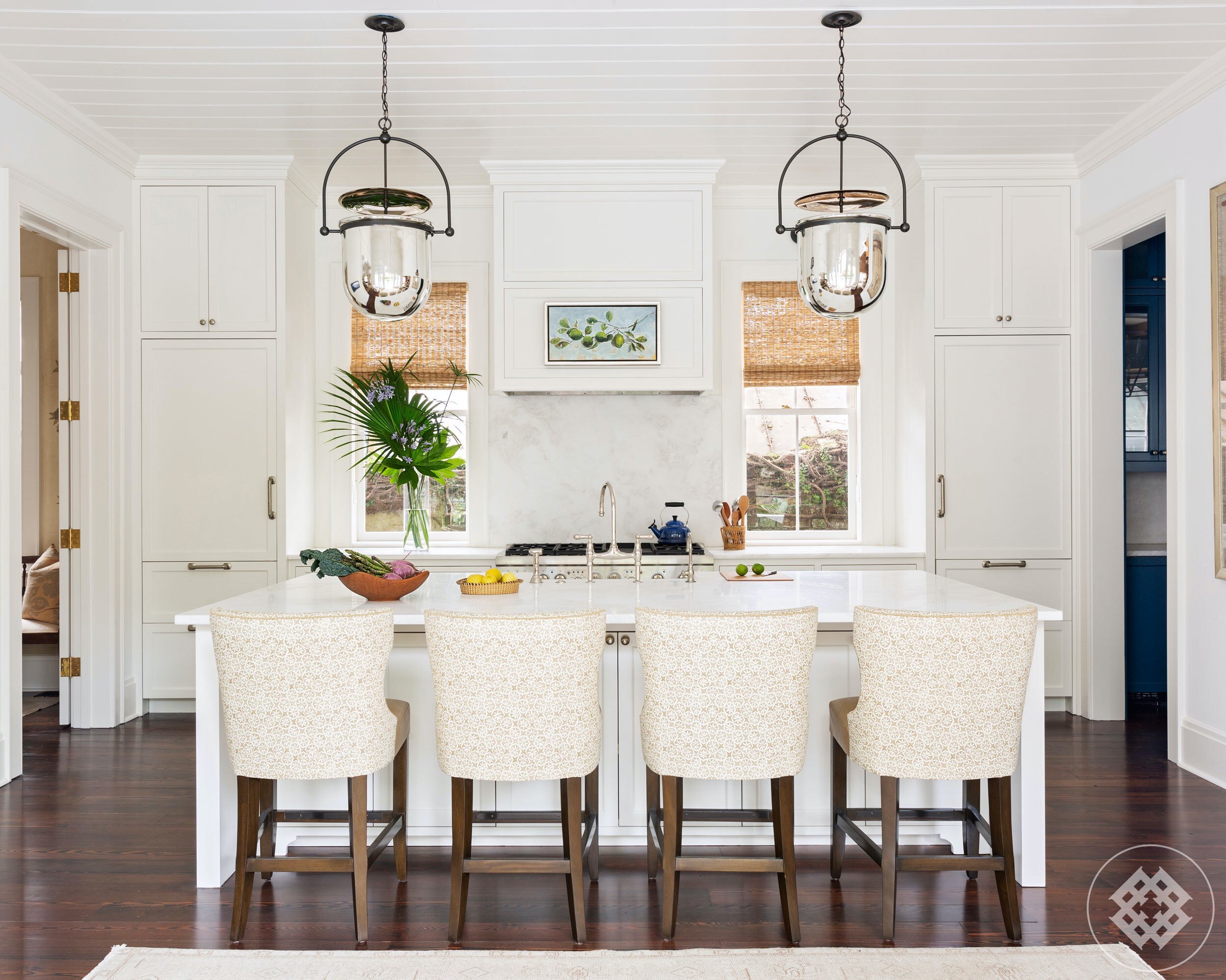 shc-10-bright-and-open-kitchen-island-with-custom-linen-and-leather-barstools-lit-by-chrome-bell-jar-urban-electric-pendants.jpg