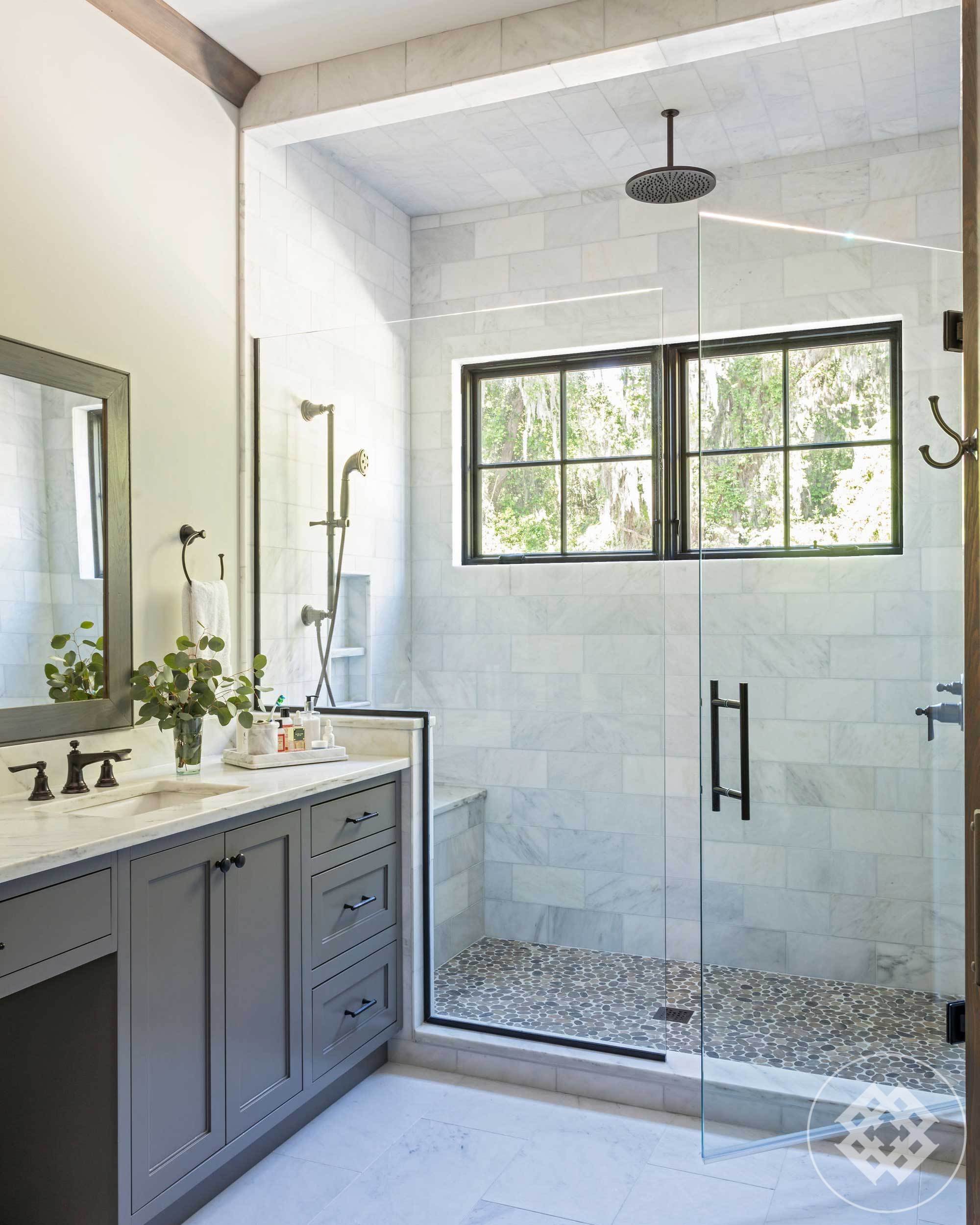 master-bath-frameless-shower-pebble-textured-tile-floor.jpg