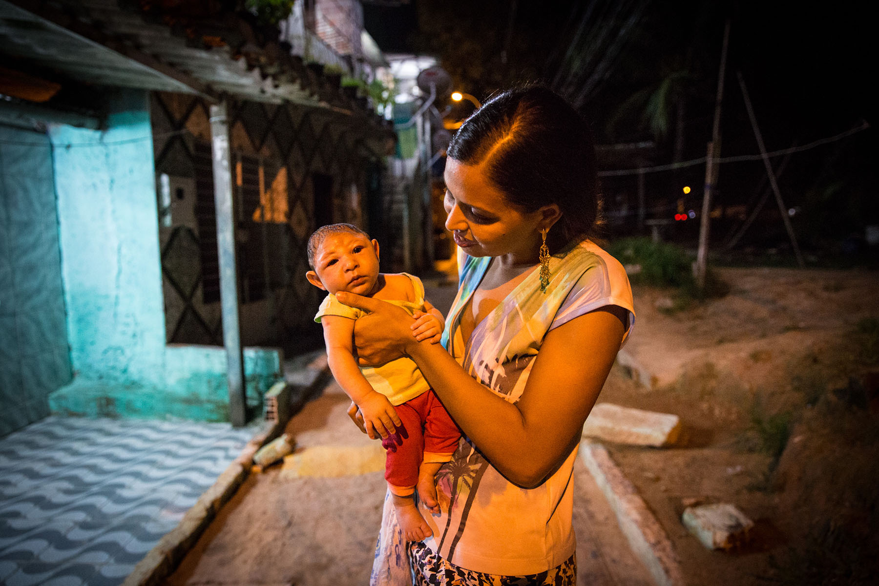 Daniele Ferreira dos Santos holds her son Juan Pedro, who was born with microcephaly, outside her house in Recife, Brazil. February 1, 2016