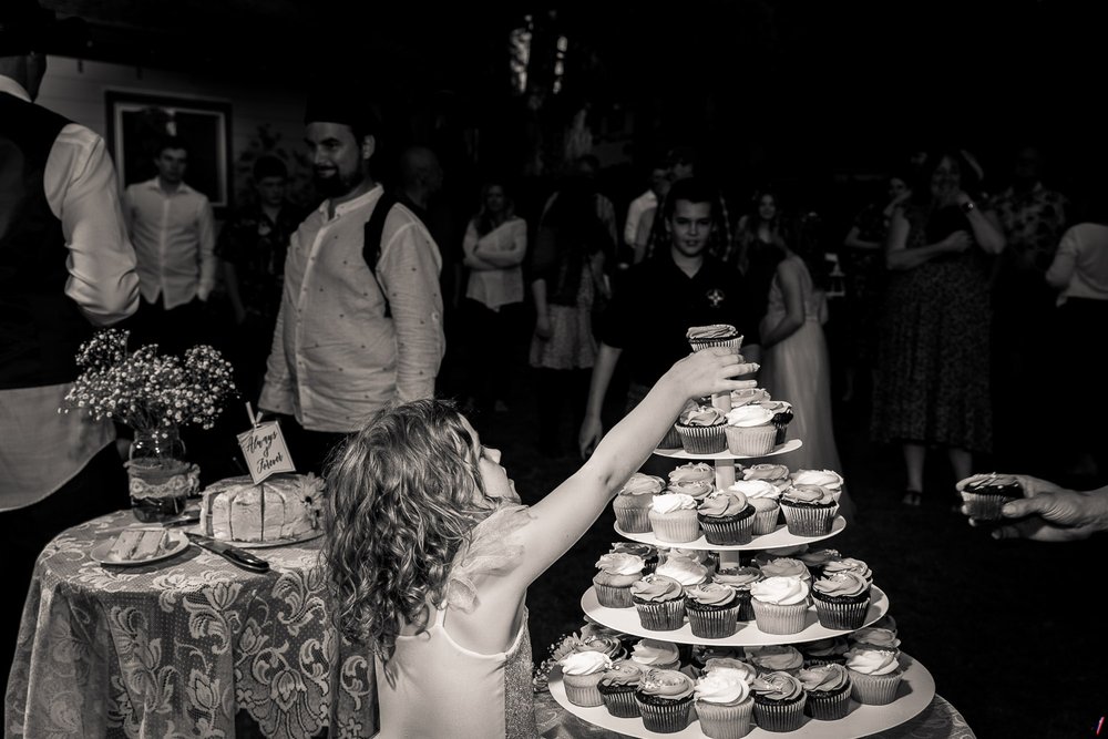 candid photographers wedding cake ate by girl (1).jpg