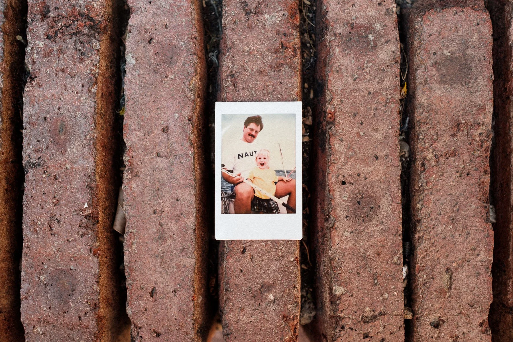 Close-up of a bride's childhood photo, an honest documentary wedding detail in Oaxaca.