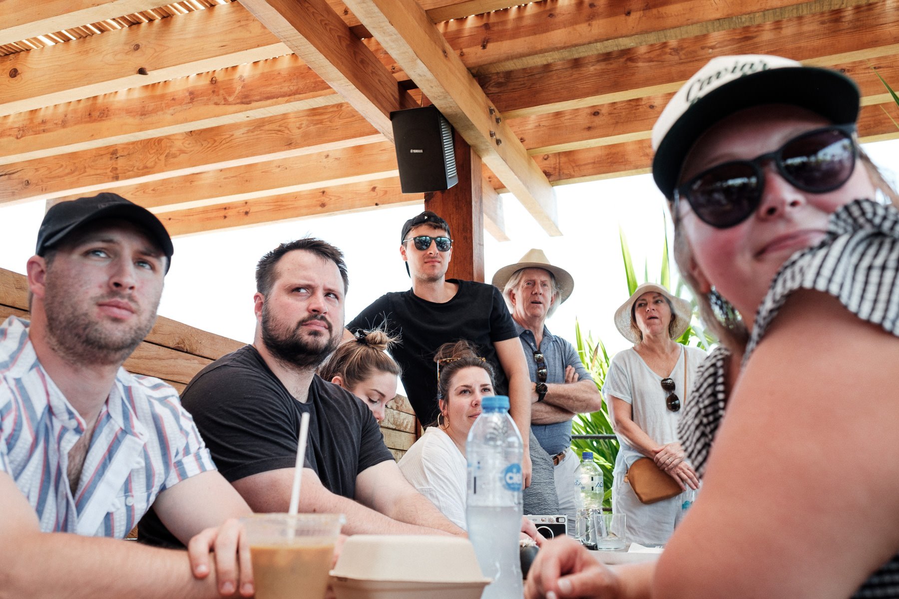 Wedding guests learning about Oaxacan mezcal traditions during a Mezcaloteca experience.
