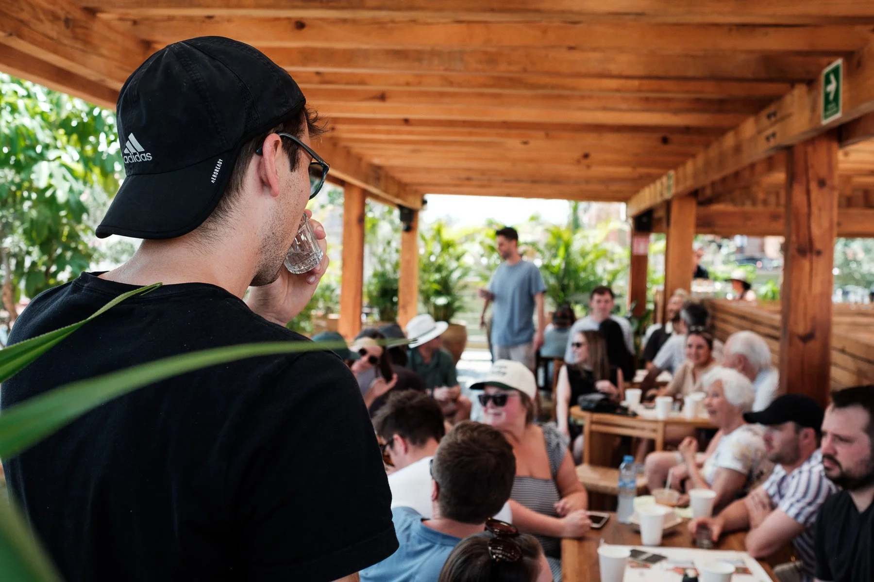 Candid documentary photography of the groom observing his guests during the wedding weekend.