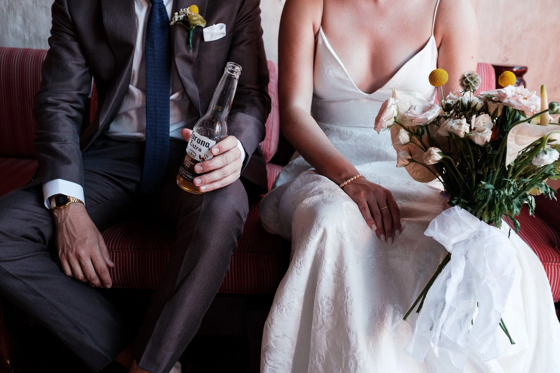 A candid close-up of the couple’s wedding attire and bouquet before the ceremony at Quinta Real.