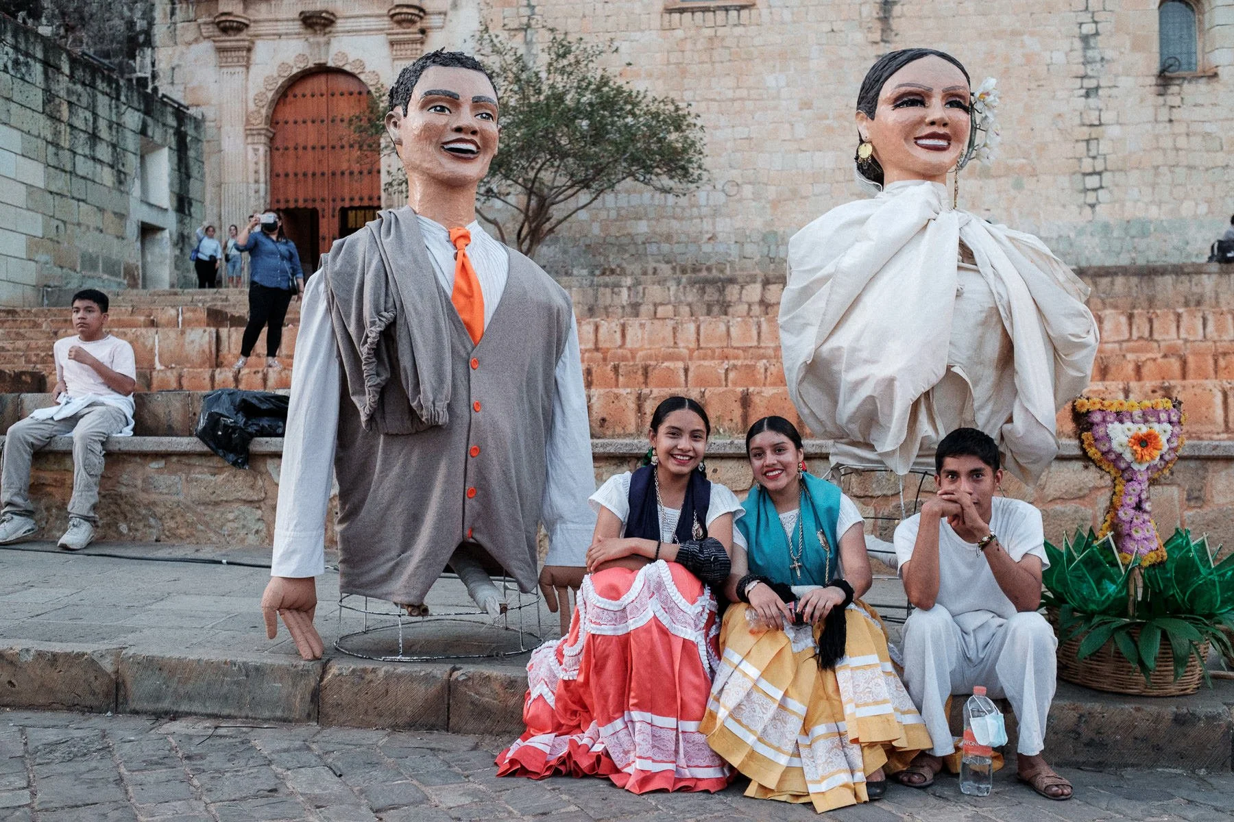 Street photography: Calenda members resting during a destination wedding in Oaxaca.