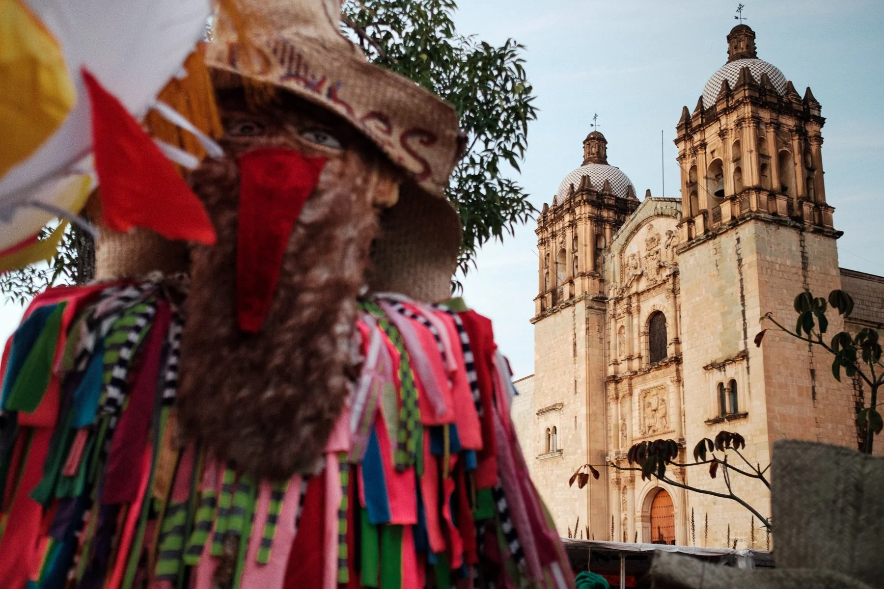 The iconic Santo Domingo Church framed by a traditional Calenda giant, by Lucca Lazzarini.