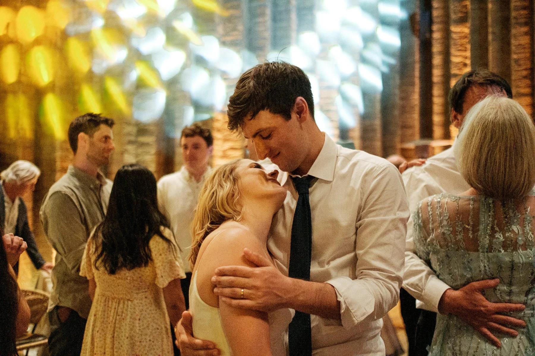 The quiet, tired gaze of a couple at the end of their wedding celebration, by Lucca Lazzarini.