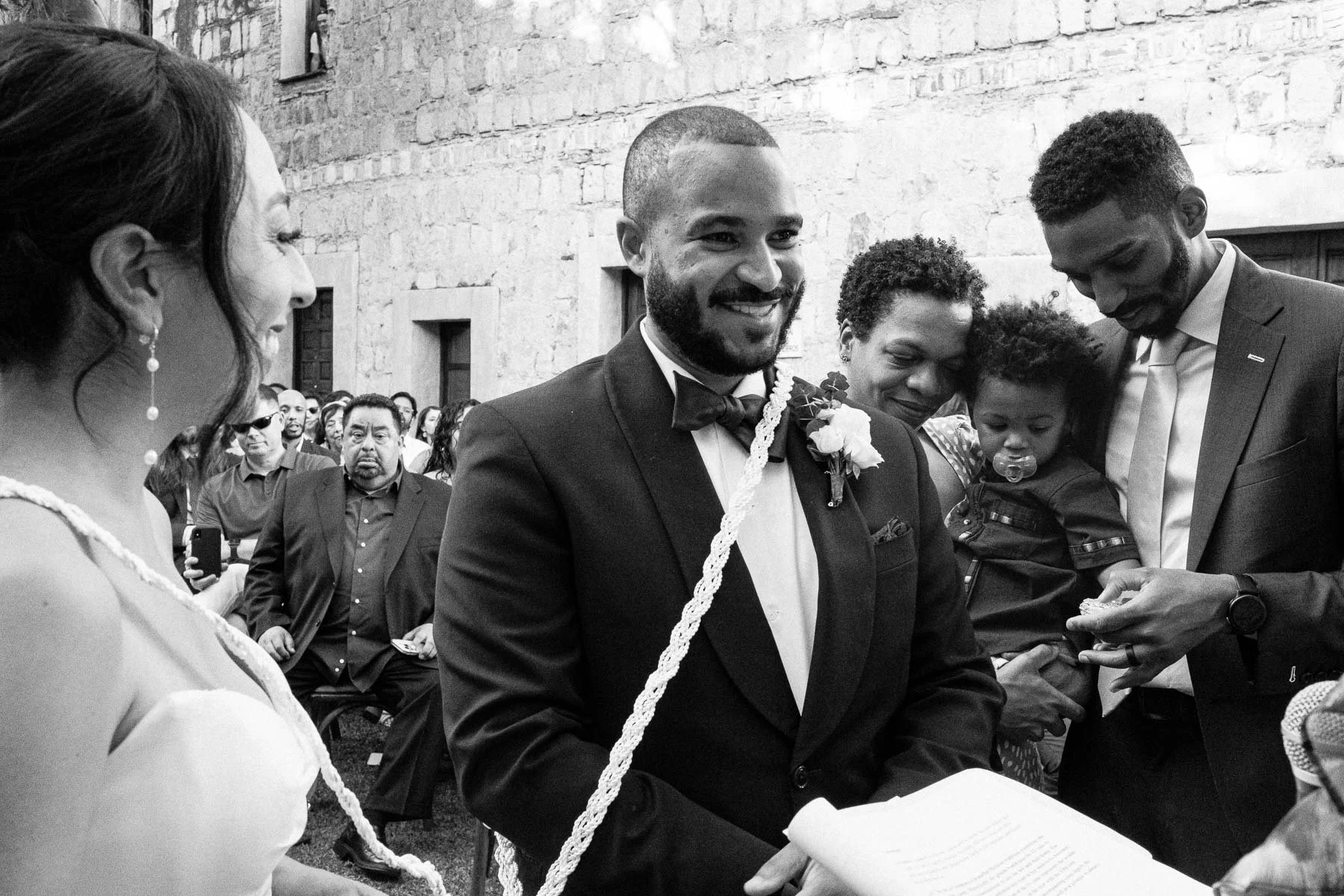 An intimate and emotional moment during the ceremony between the couple and their close family, framed by the historic 16th-century Lavaderos.