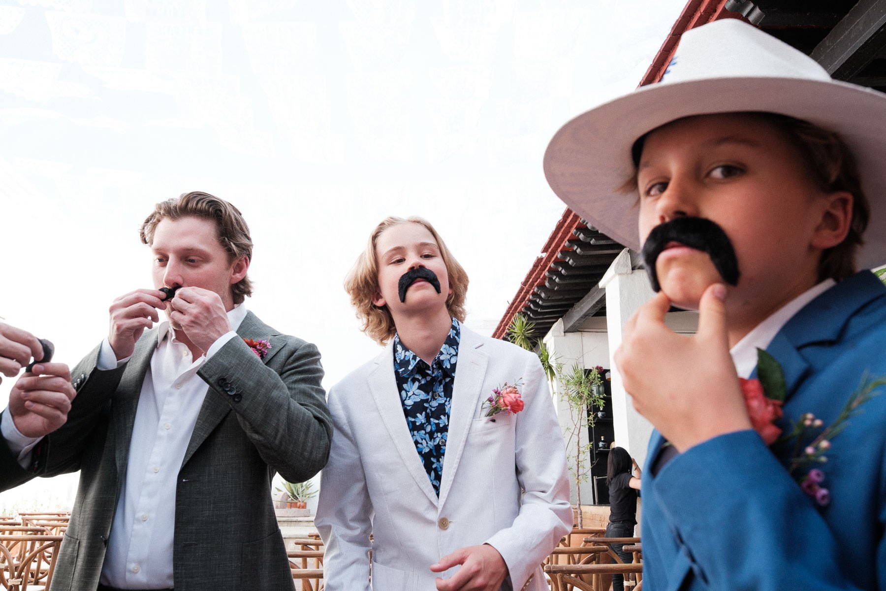 funny-wedding-guests-fake-mustaches-documentary-photography-oaxaca.jpg
