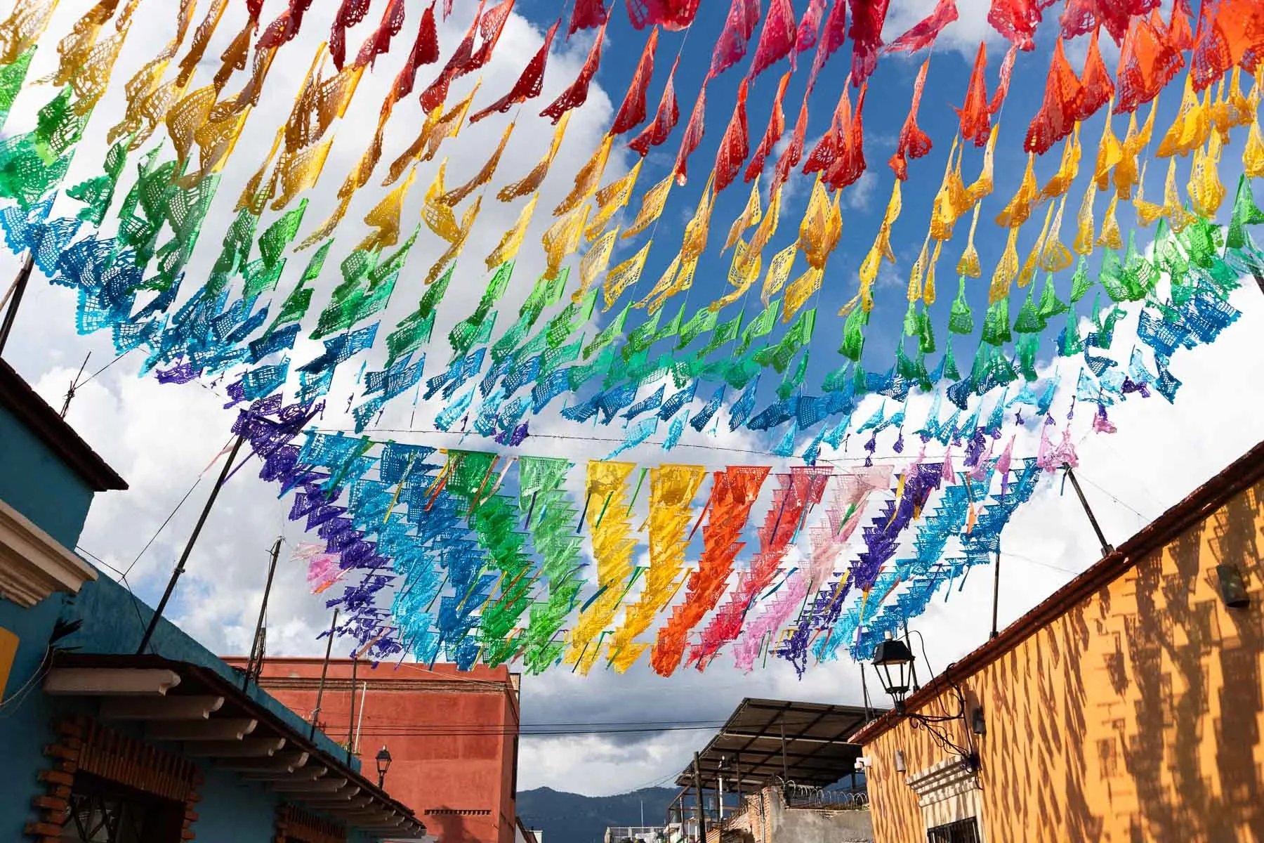 Traditional colorful papel picado decorations at the entrance of Asador Bacanora for a destination wedding.