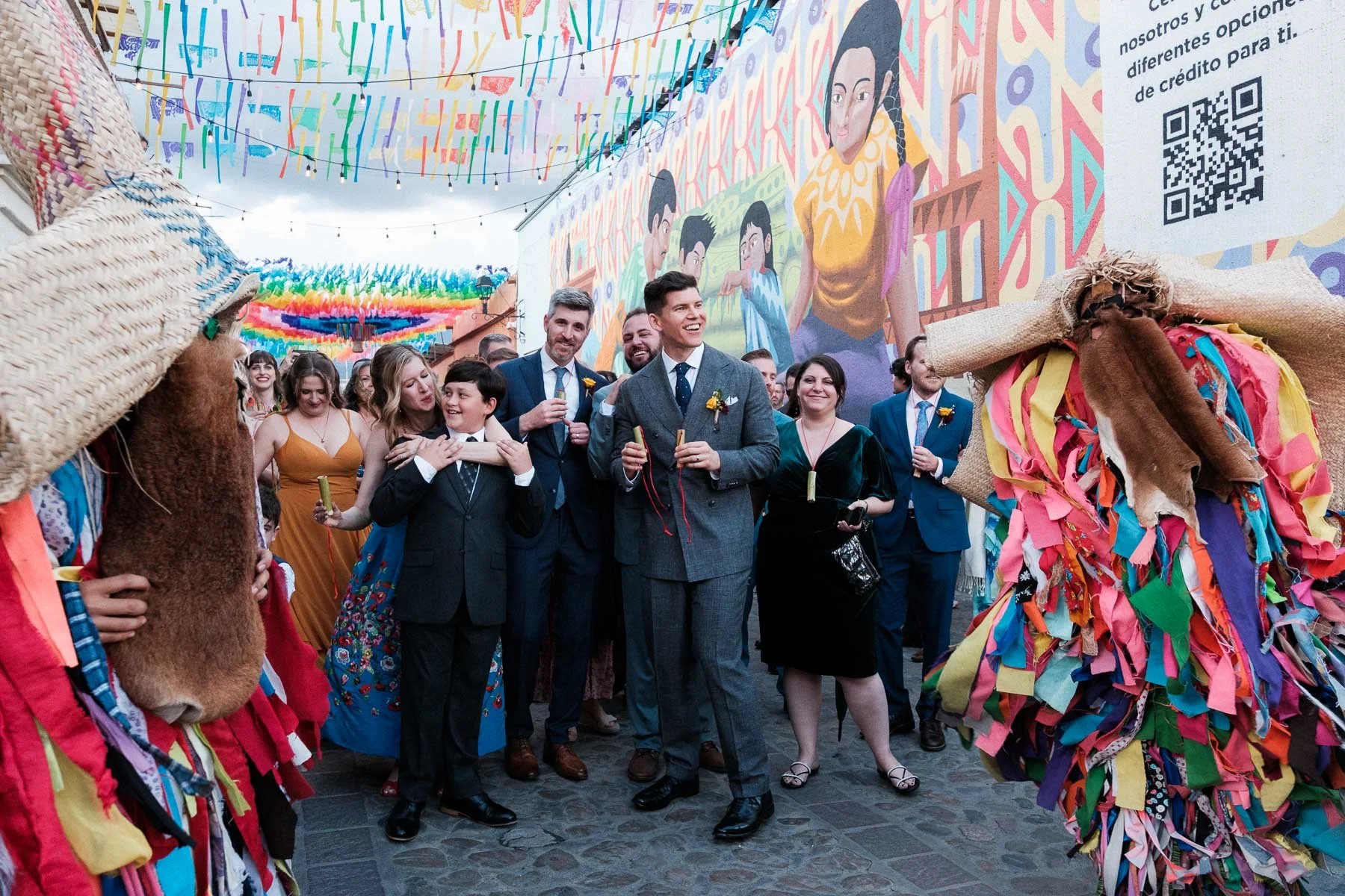 The couple surrounded by their family at the beginning of the vibrant Calenda parade in Oaxaca.