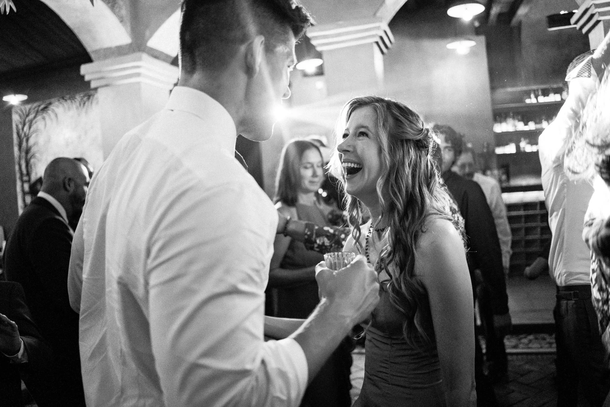 The newlyweds dancing with pure joy during their high-energy wedding party at Asador Bacanora.