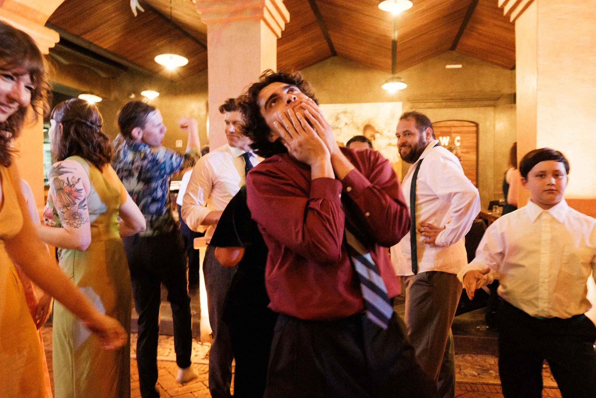 A candid and humorous guest reaction captured during the wedding reception celebration in Oaxaca.