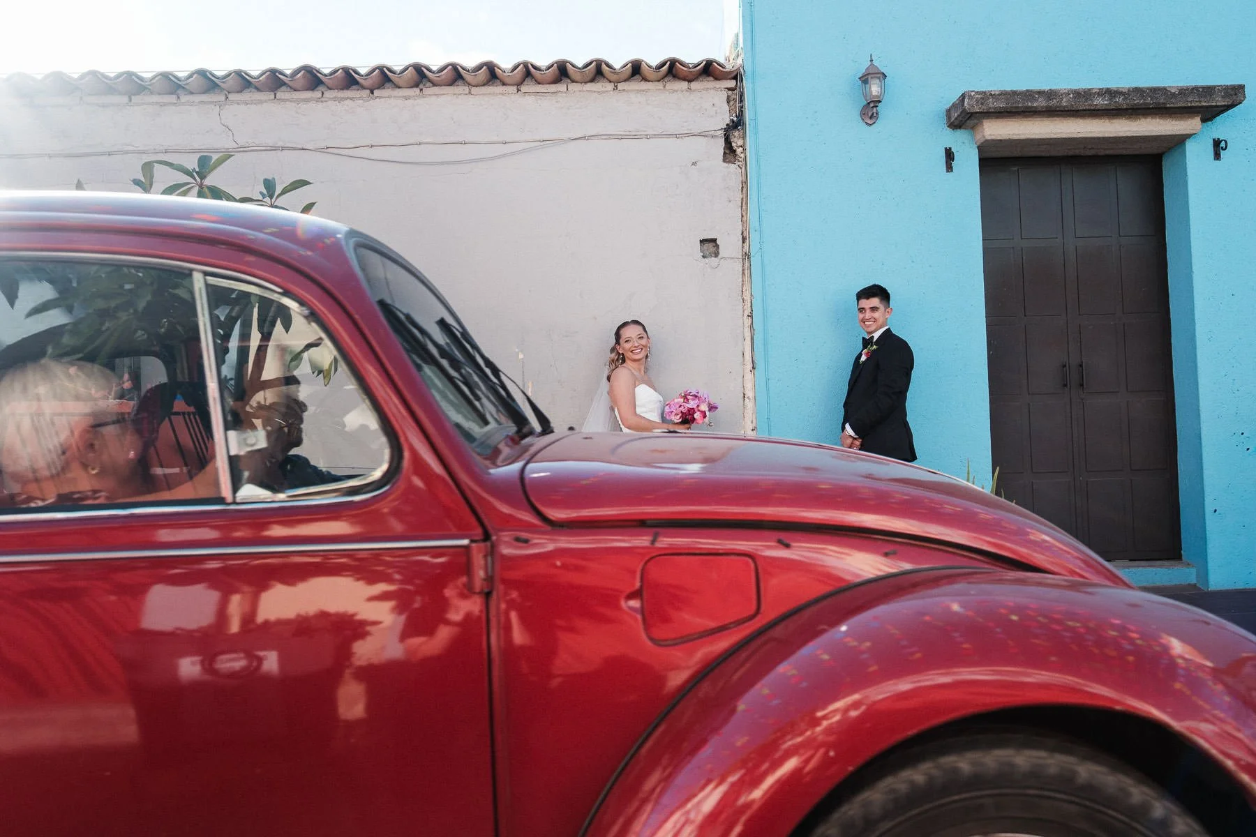 A classic "Vocho" moment: elderly couple greeting newlyweds in Jalatlaco, Oaxaca.