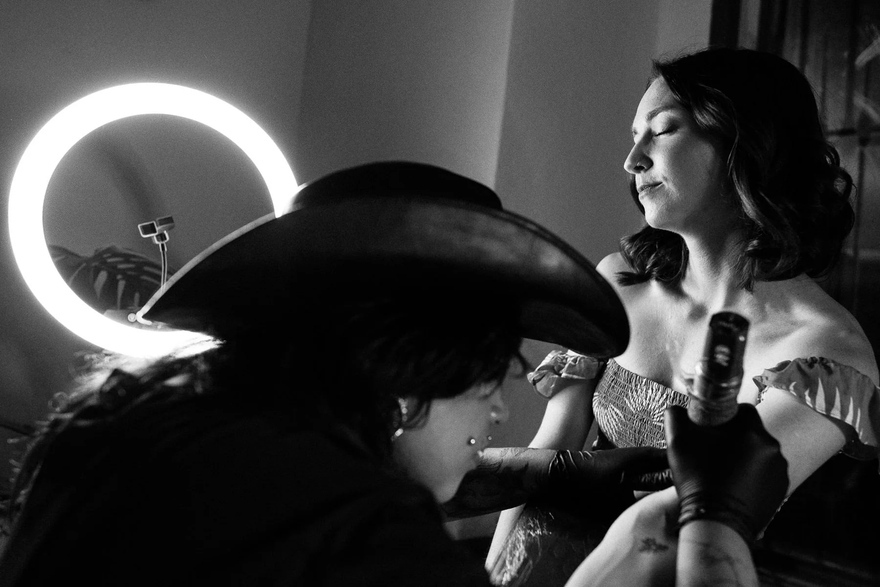 Bride getting a real tattoo at her wedding celebration