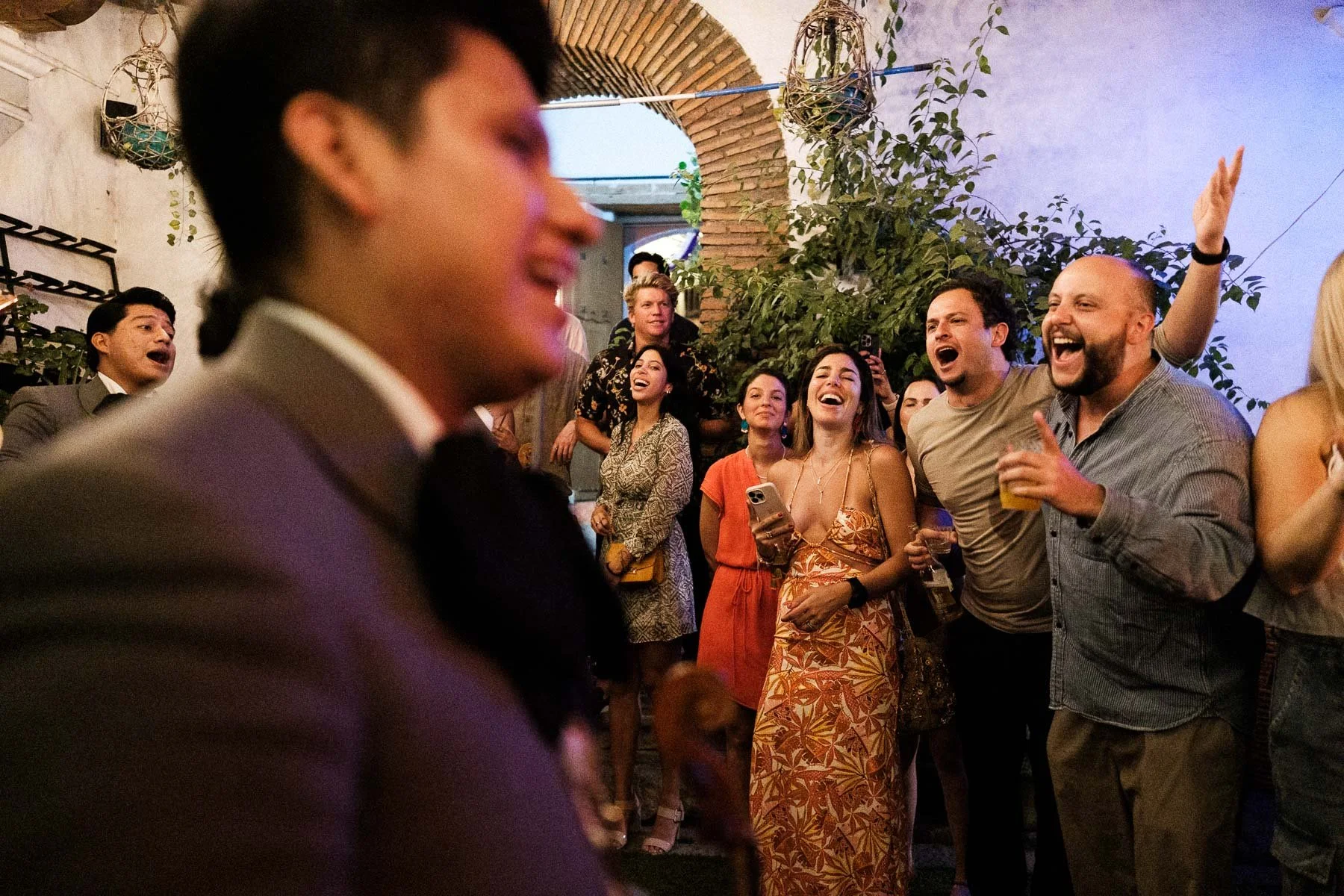 Mariachi band singing with wedding guests in Oaxaca