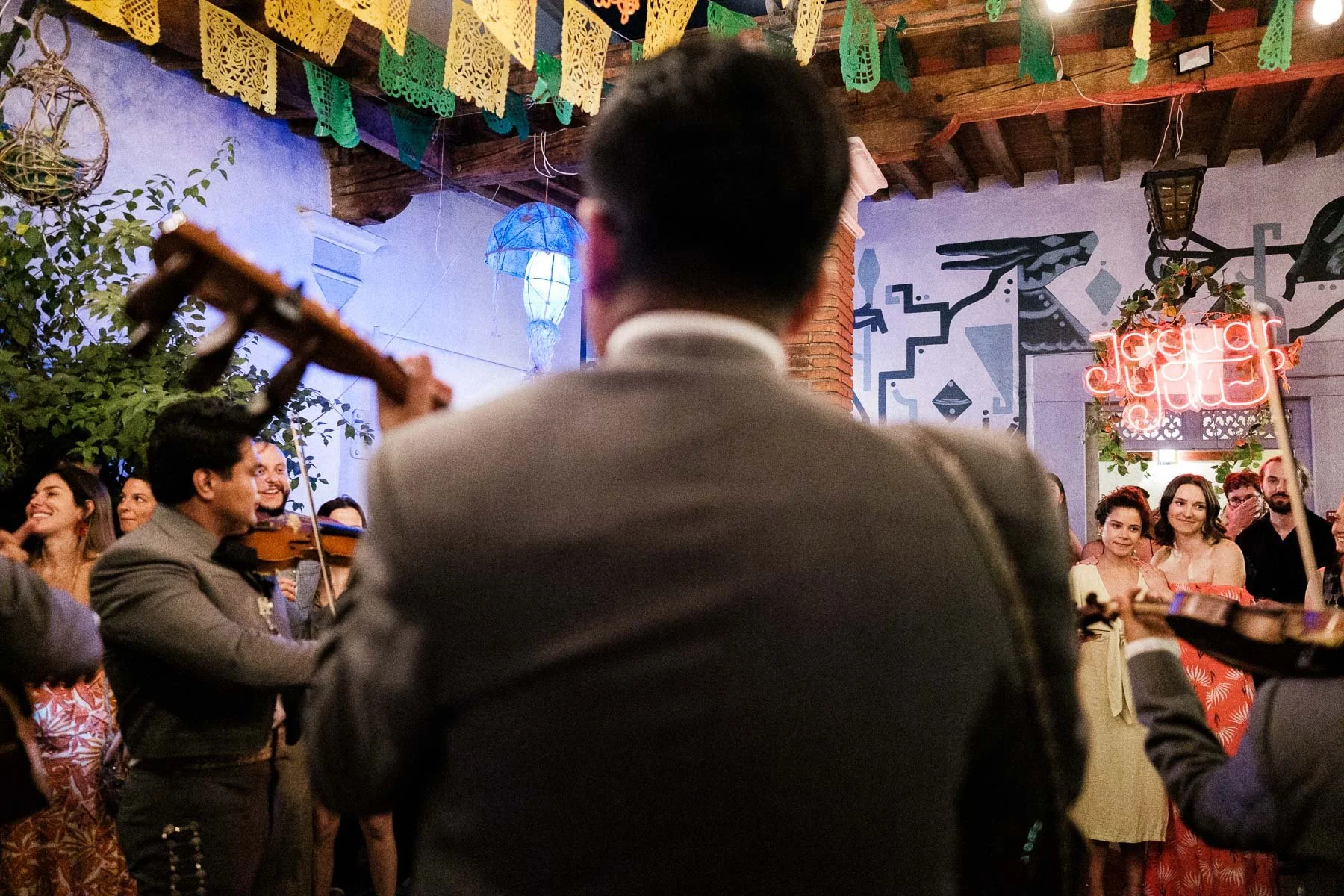 Brides enjoying the mariachi band at their wedding