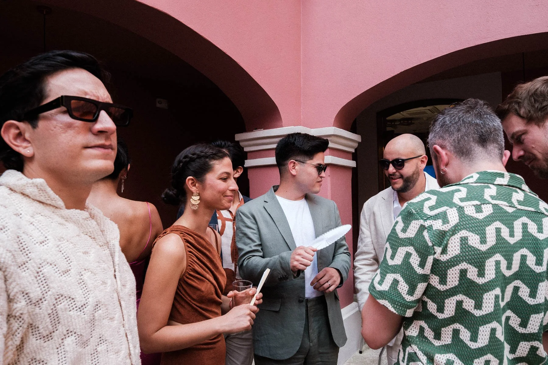 Wedding guests chatting before the ceremony at Hotel City Centro.
