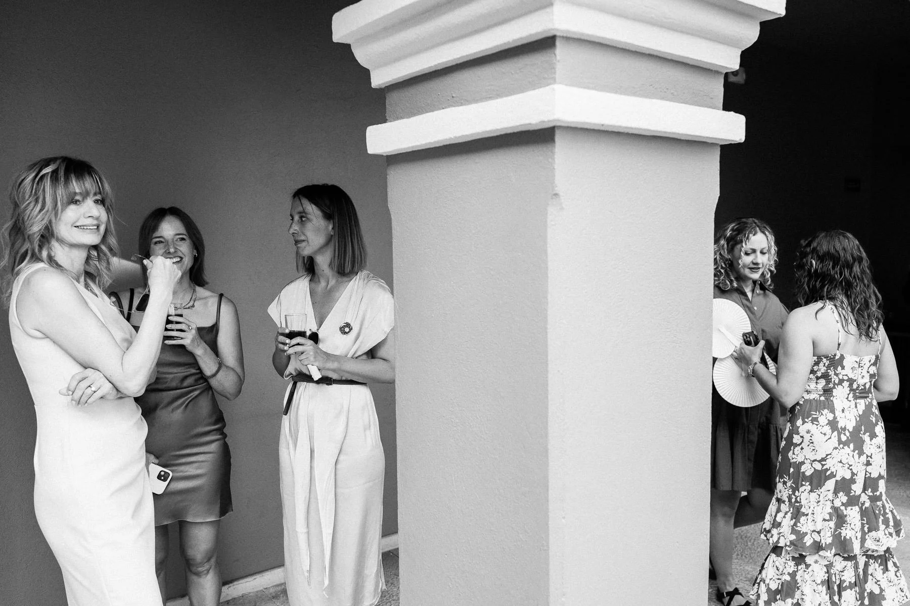 Wedding guests conversing in the courtyard at Hotel City Centro.
