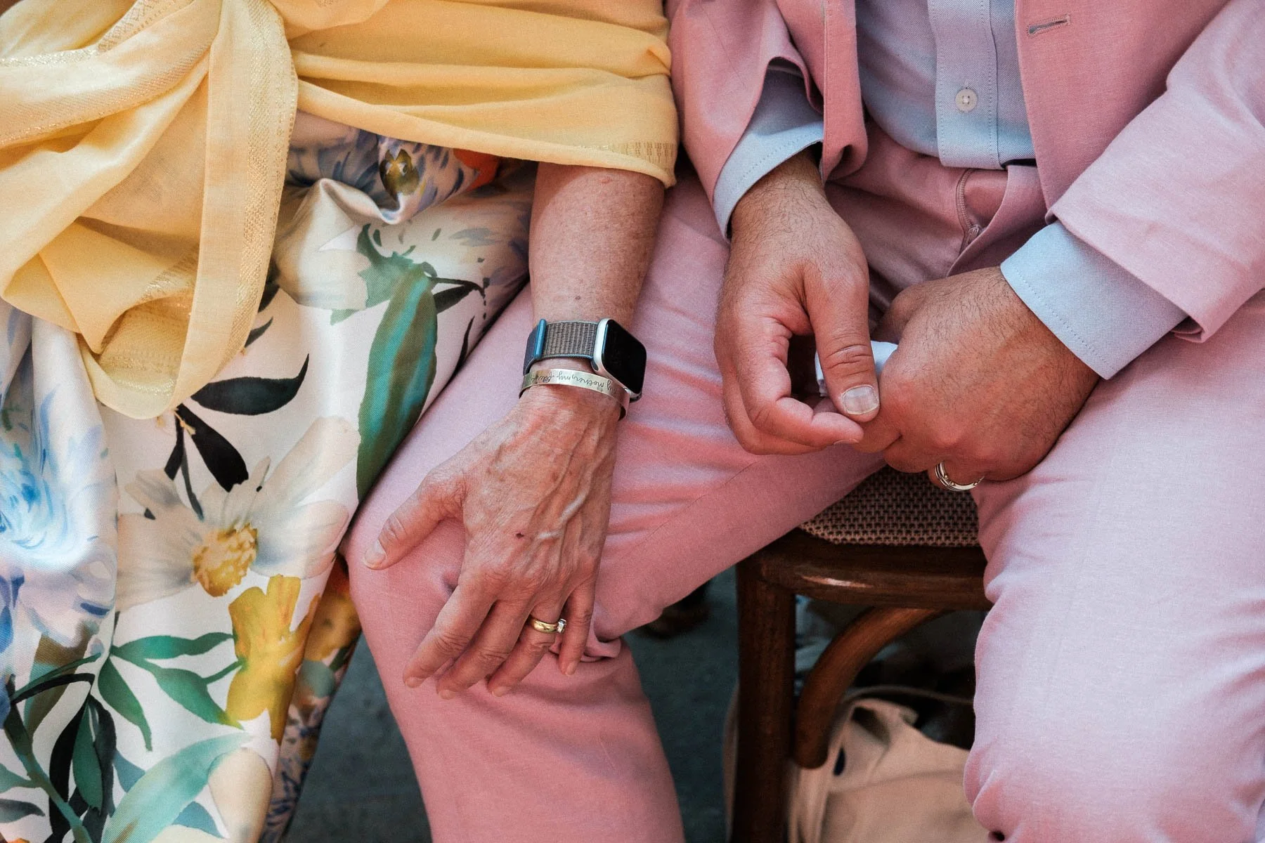 Close-up of hands and colors during an authentic documentary wedding ceremony.