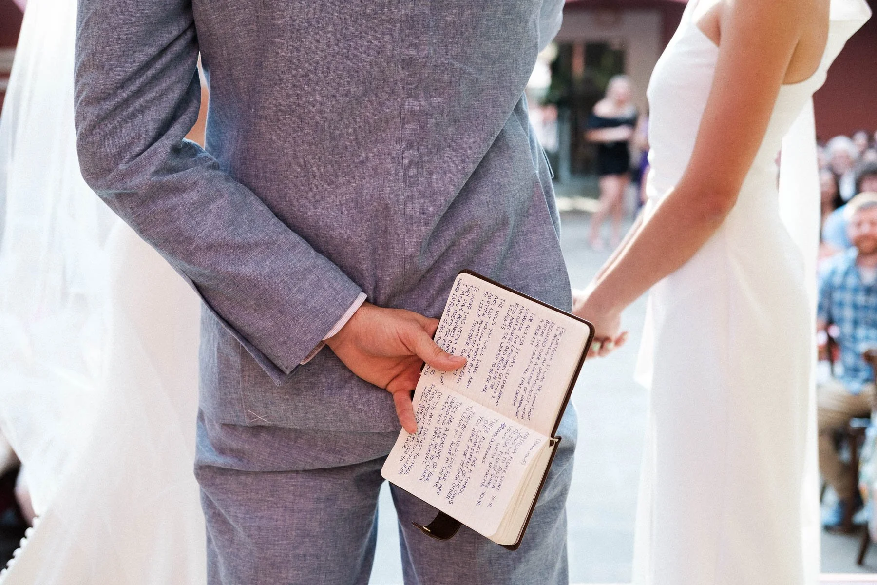 Detail of the officiant's notebook just before the ceremony ends.