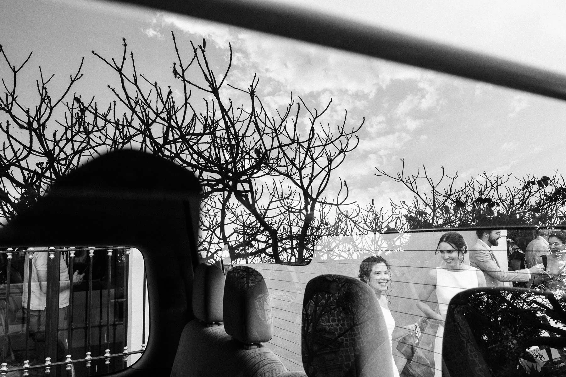 A creative reflection of the brides during the vibrant Calenda procession.