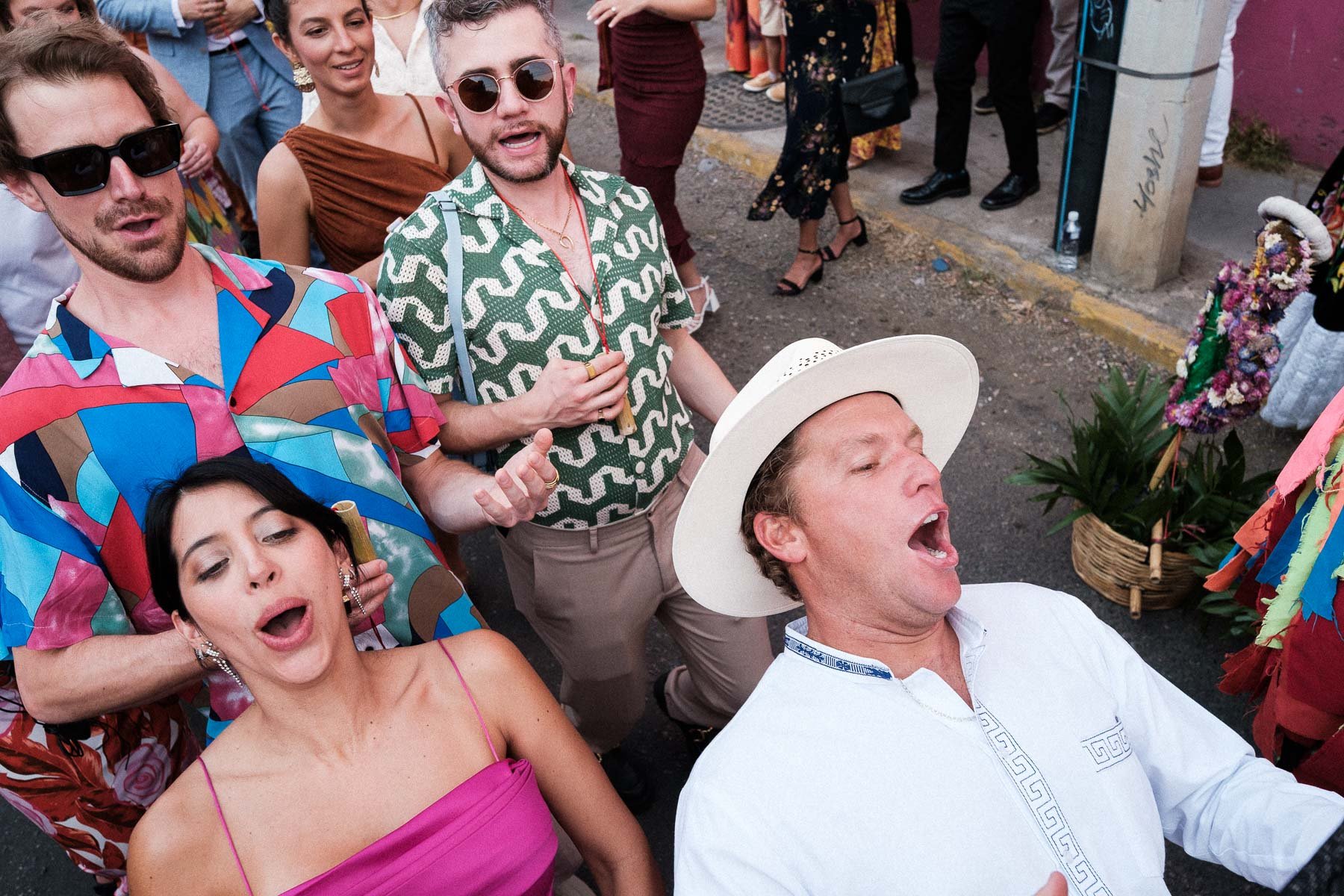Friends and guests dancing through the streets during the Calenda parade.
