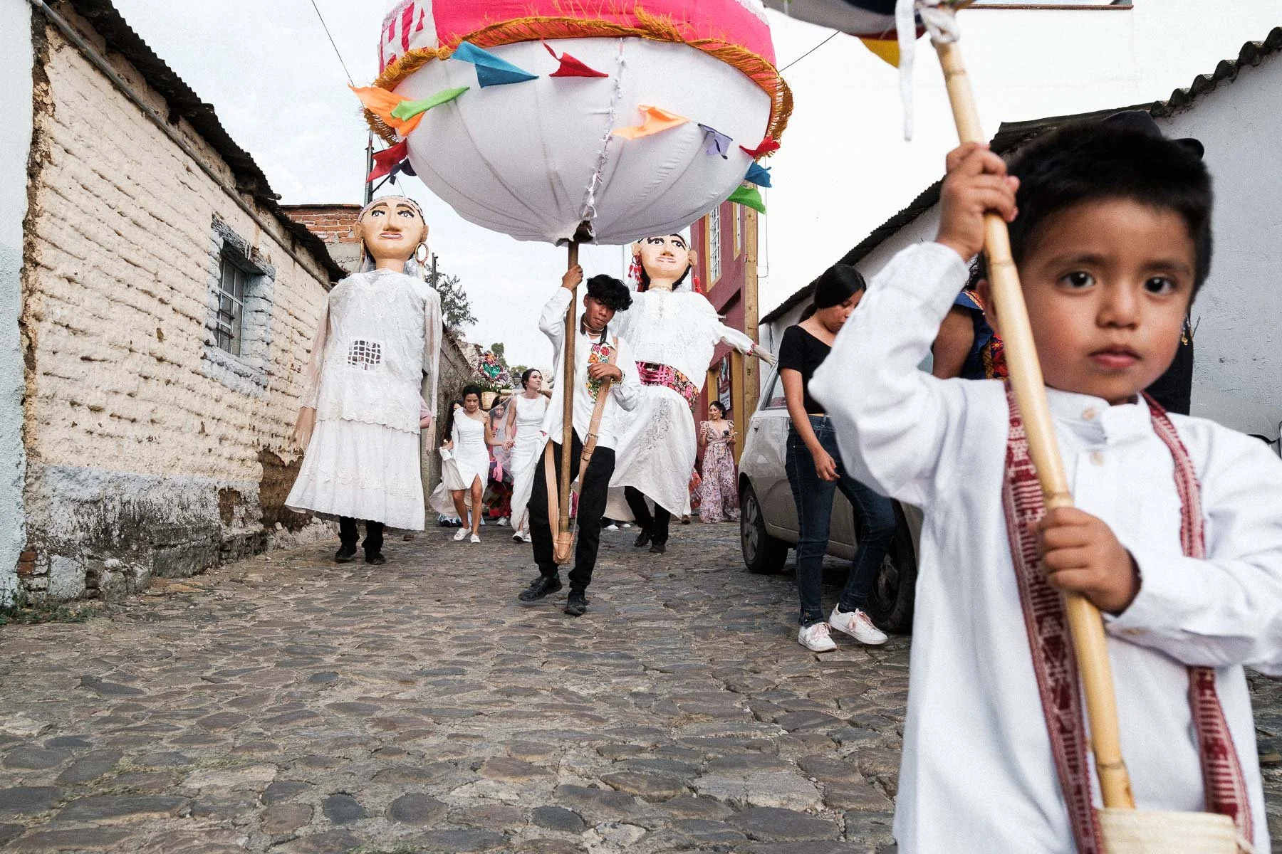 A child participating in the traditional Calenda parade in Oaxaca.
