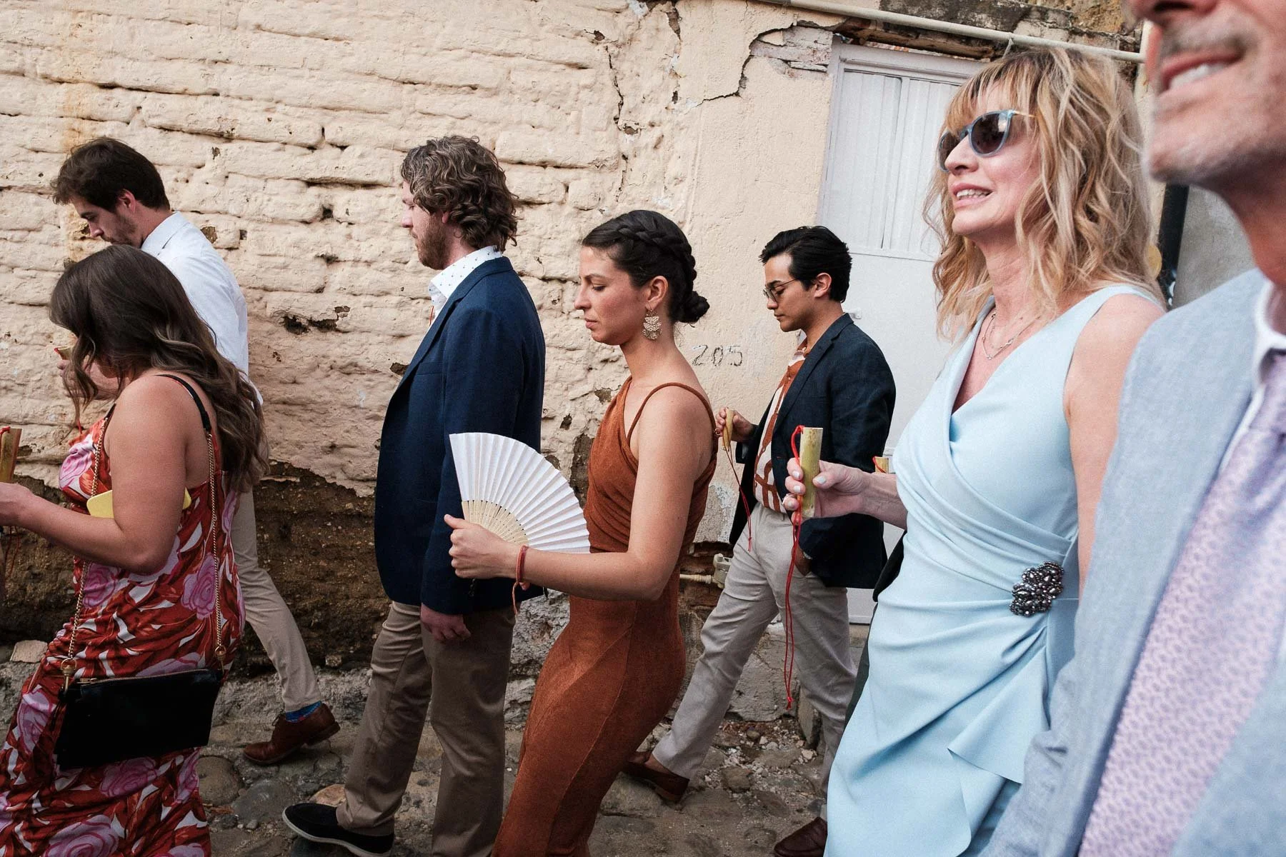 Wedding guests walking through the picturesque streets of Jalatlaco.
