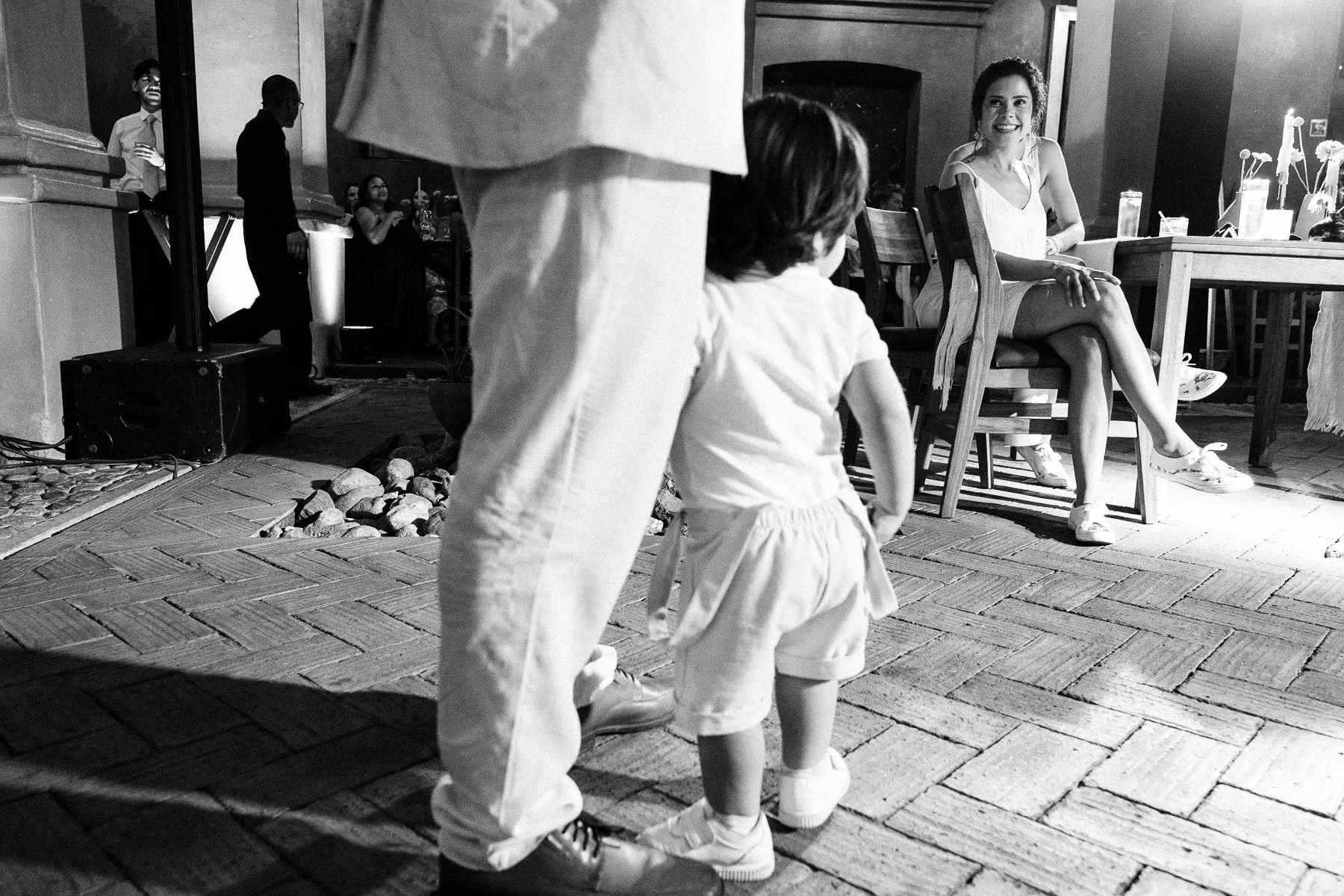 The bride's brother giving his speech while holding his nephew.