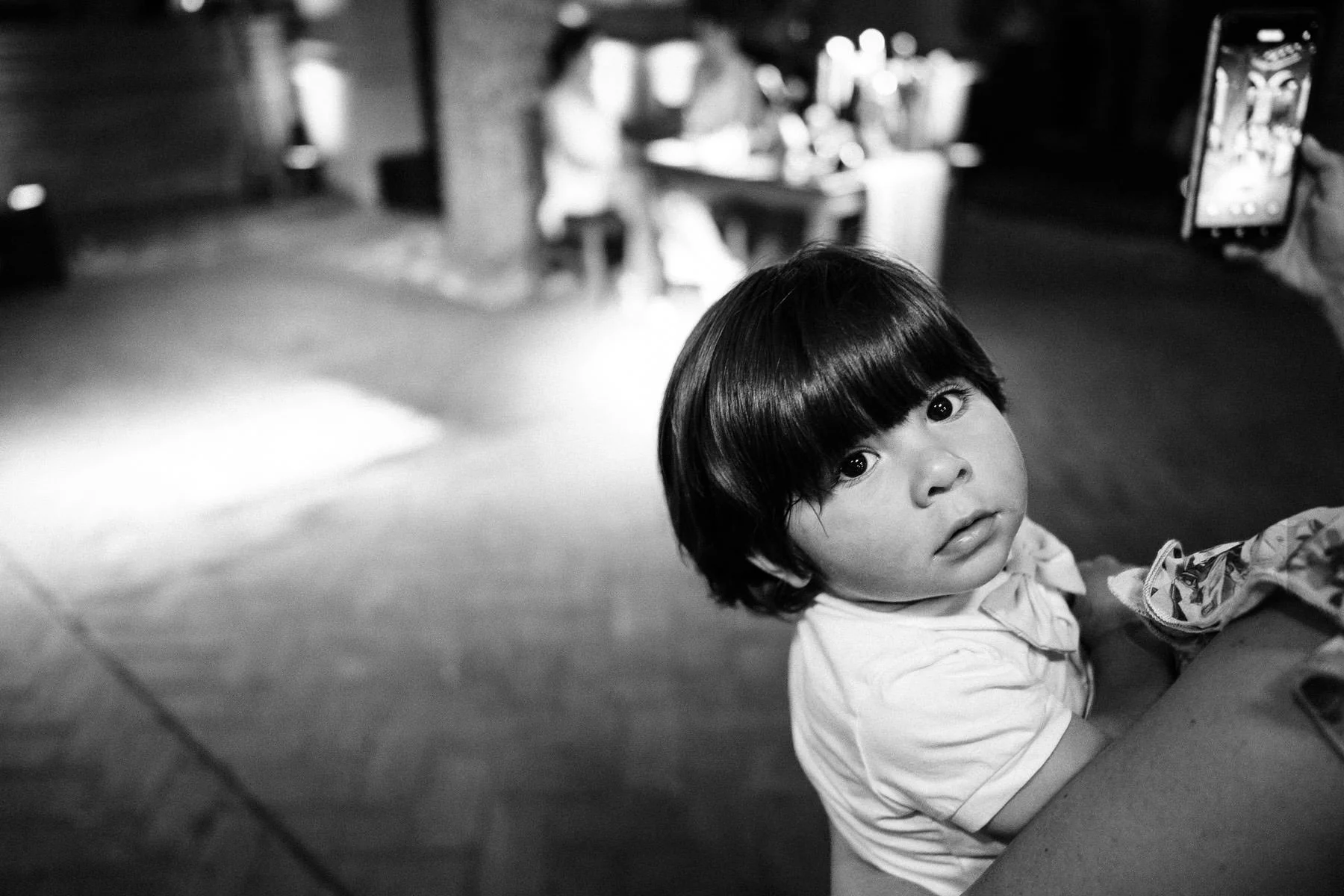 A candid portrait of the bride's nephew during the reception.